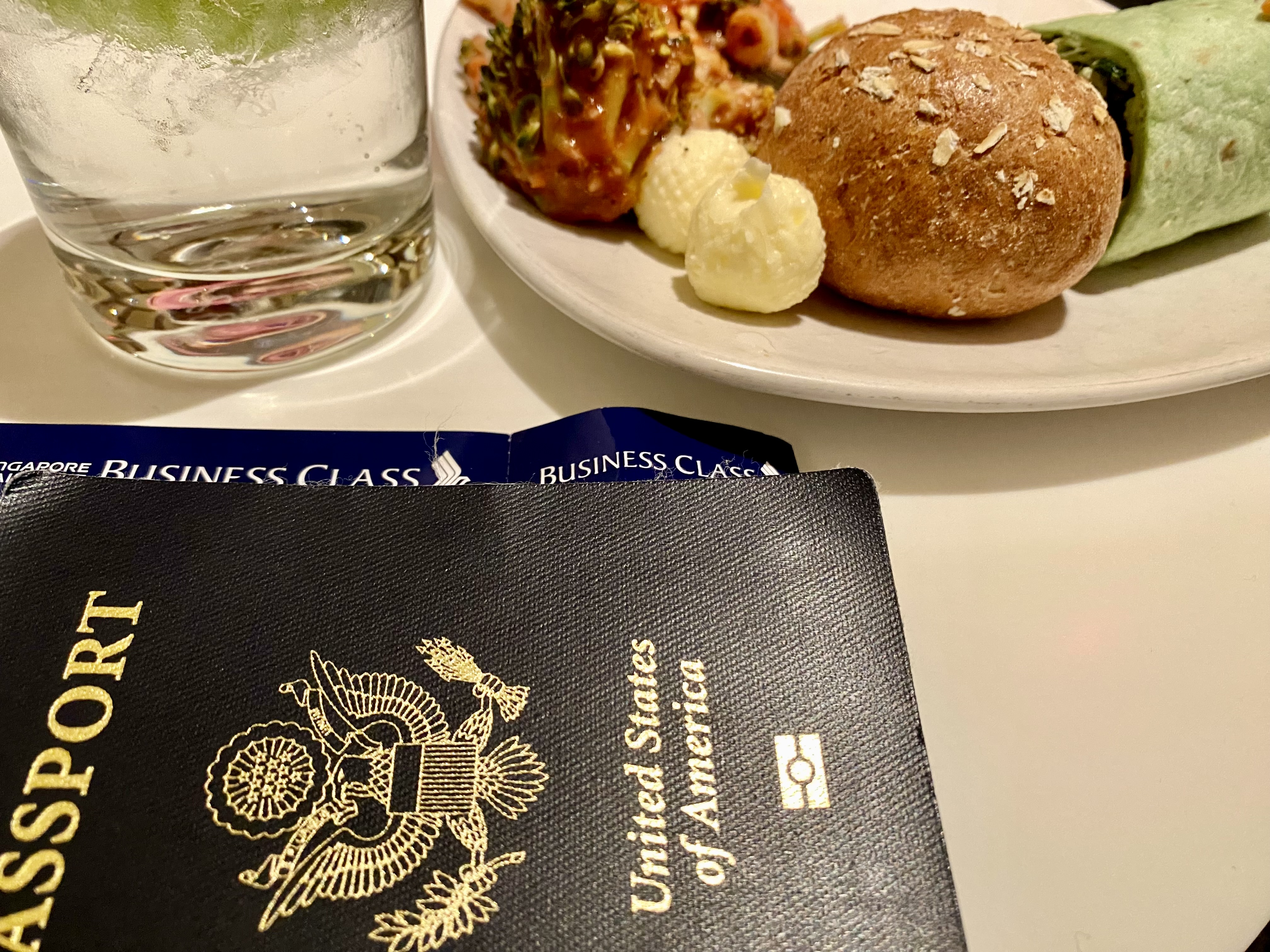 a passport and food on a table