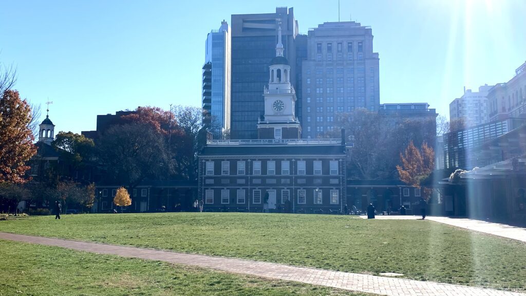 a building with a clock tower in the background