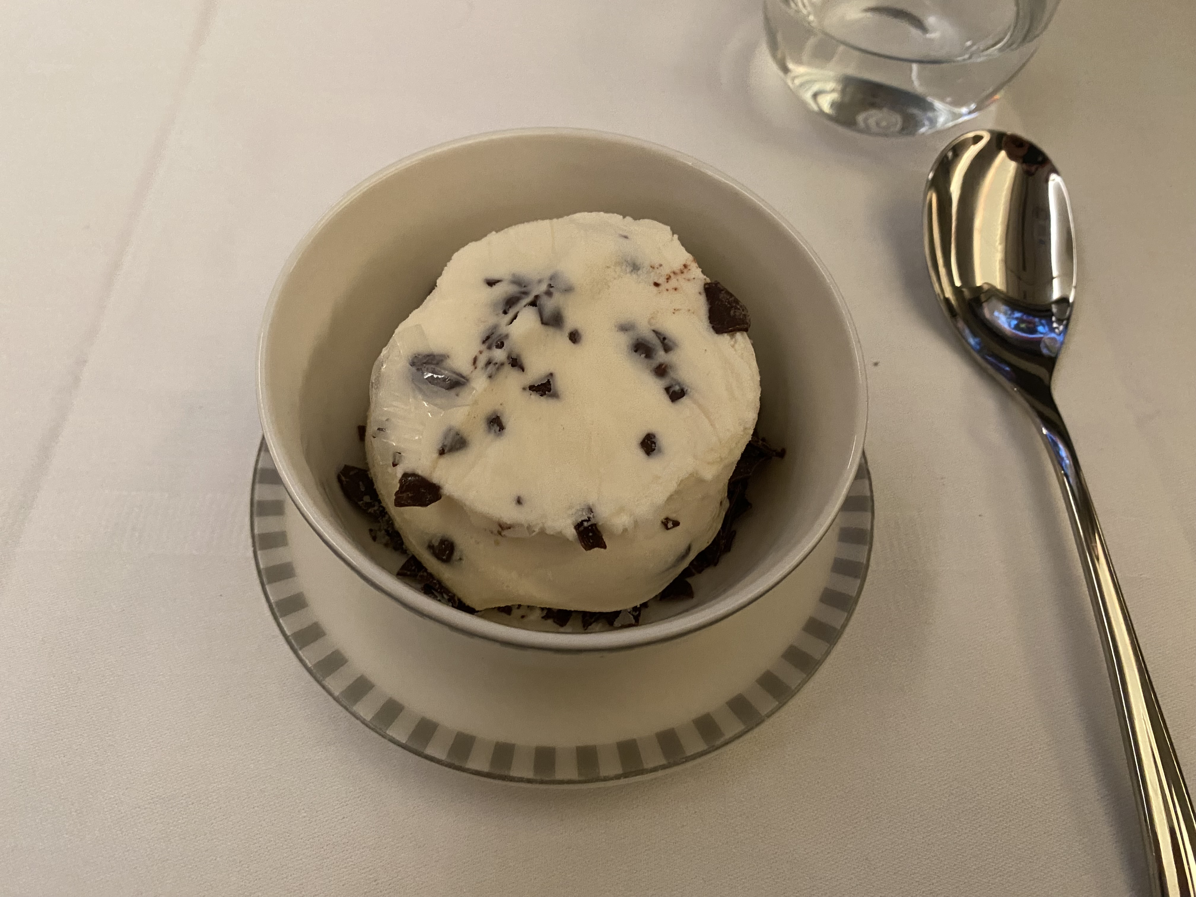 a bowl of ice cream with chocolate chips on top