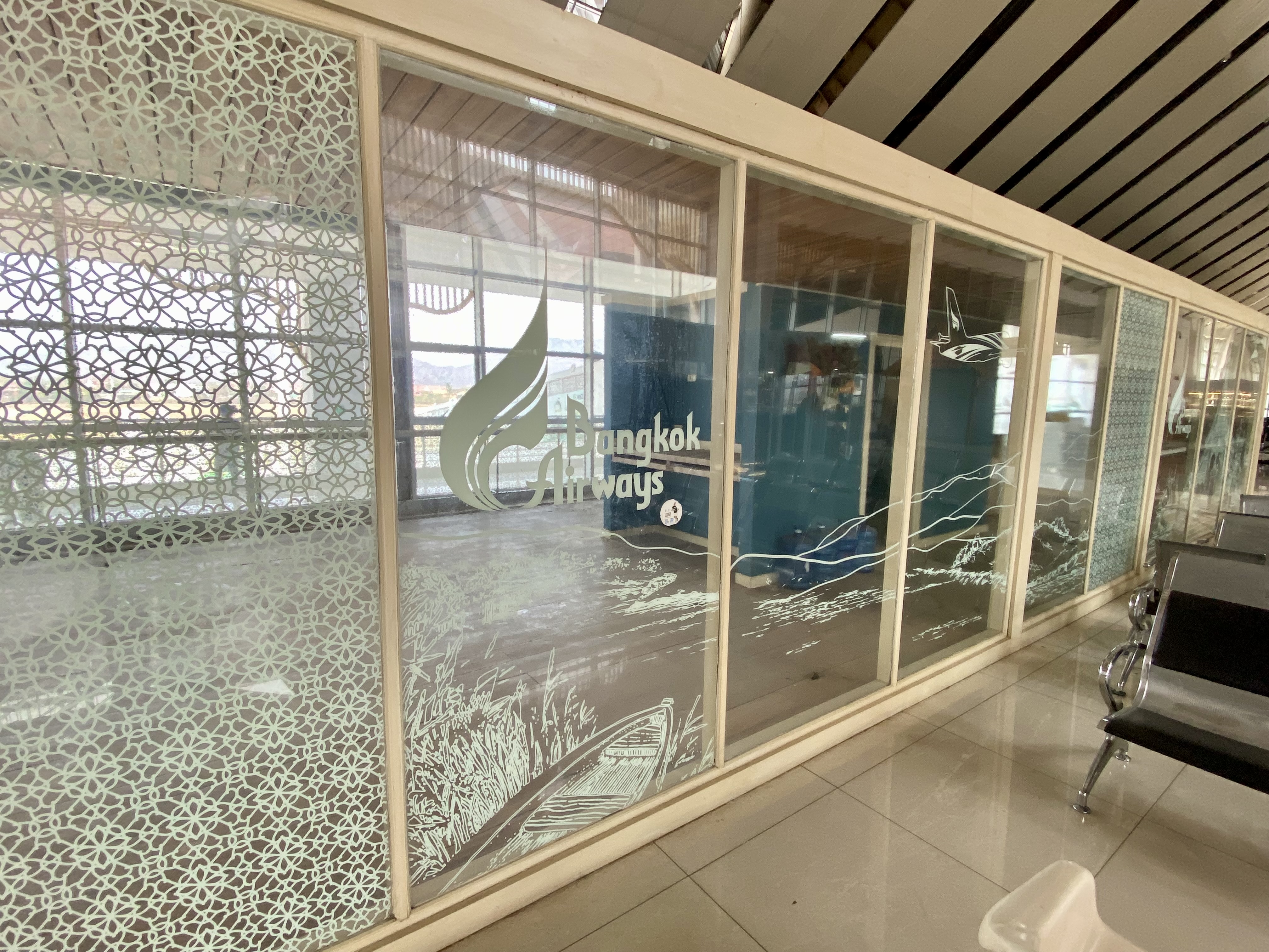 a glass wall with a design on it