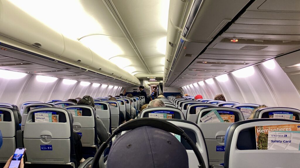 a plane with people sitting in the seats