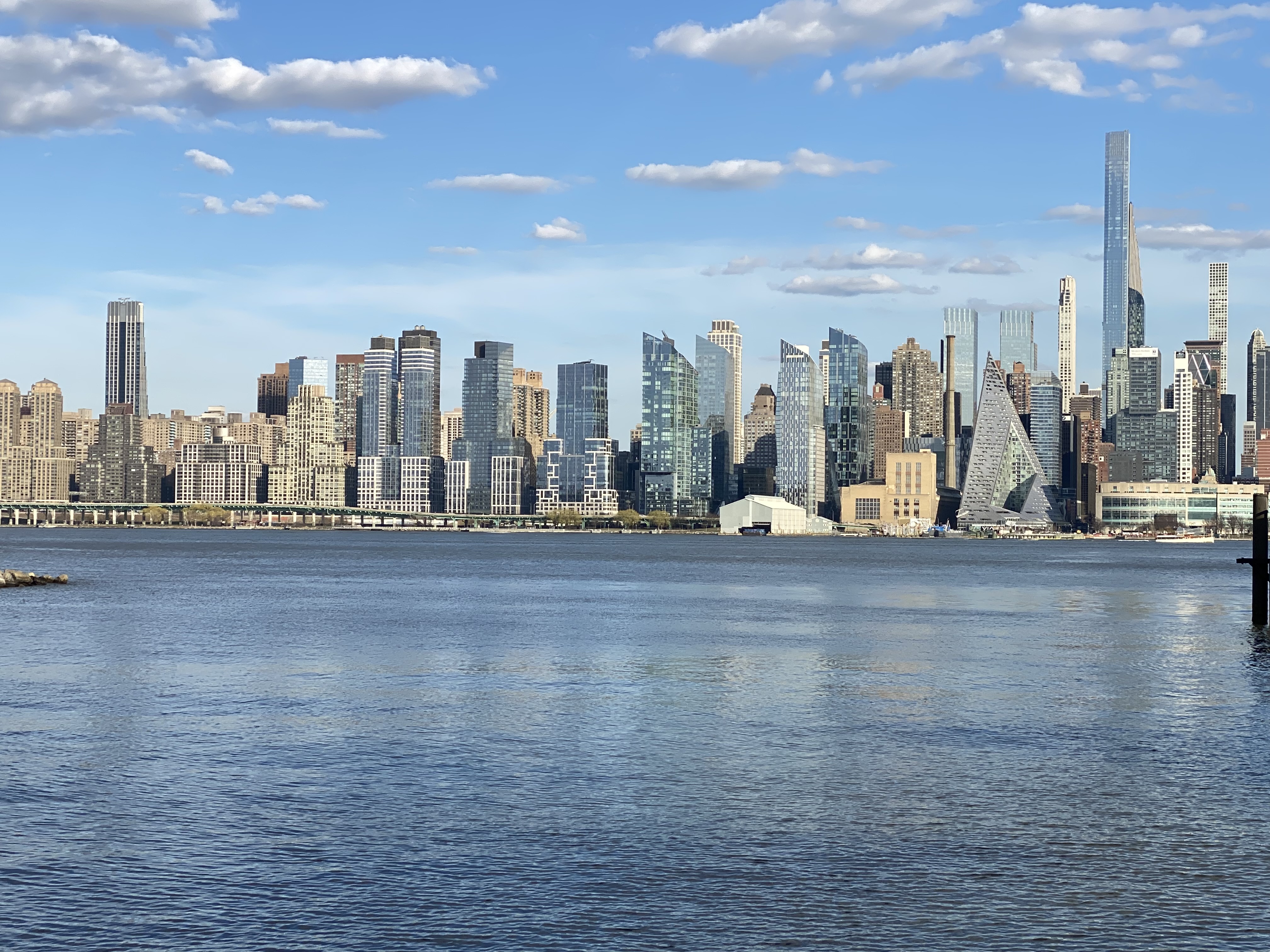 a city skyline with a body of water