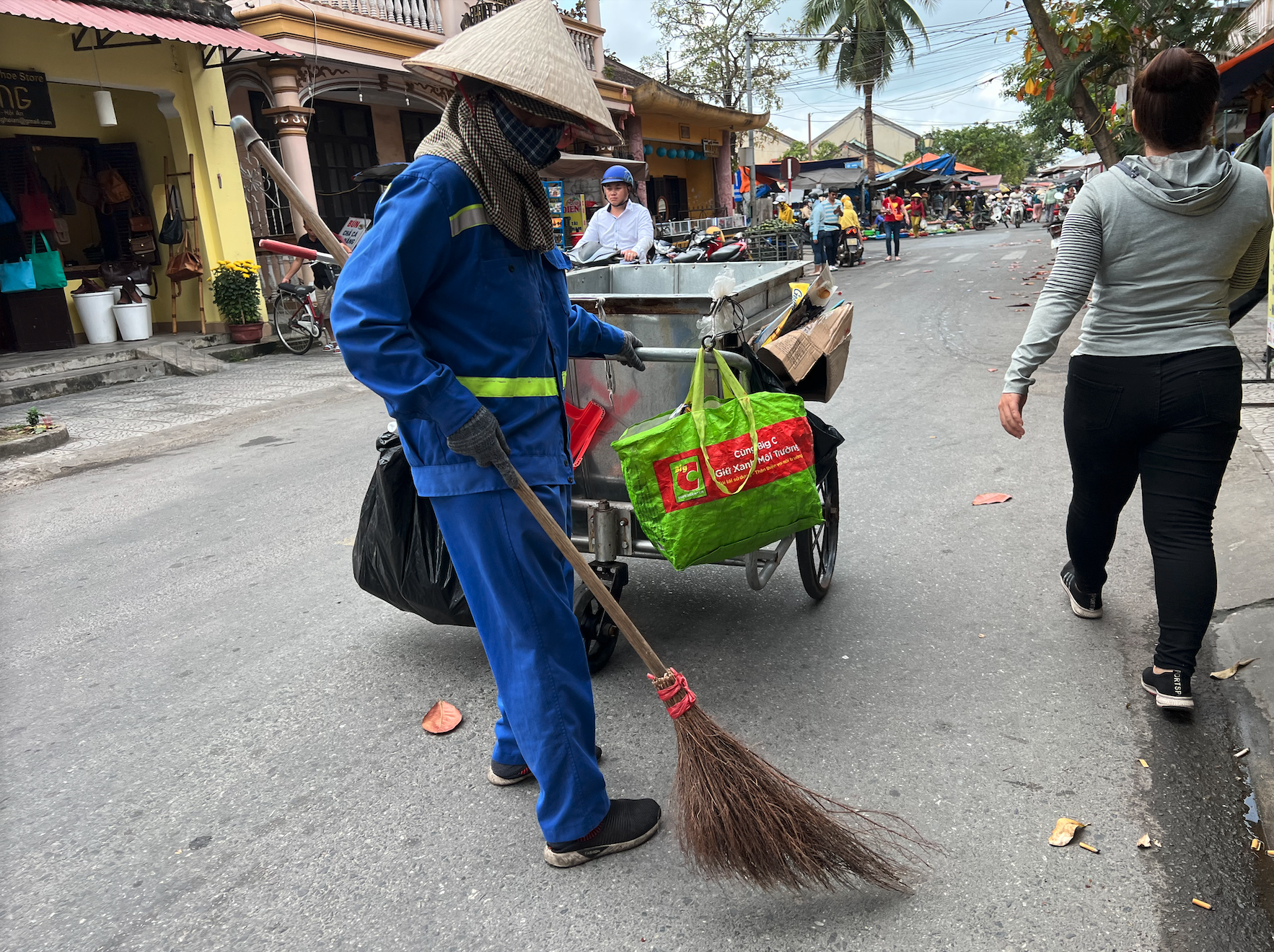a person wearing a hat and a broom