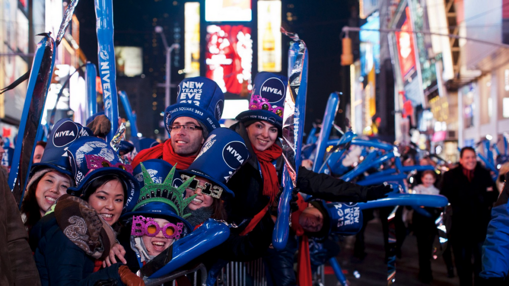 a group of people wearing hats and smiling