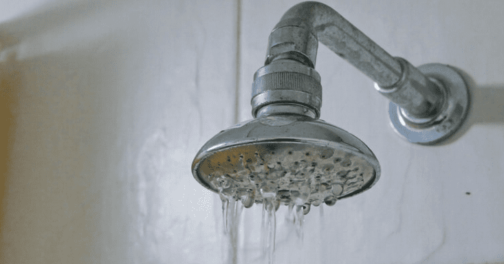 a shower head with running water