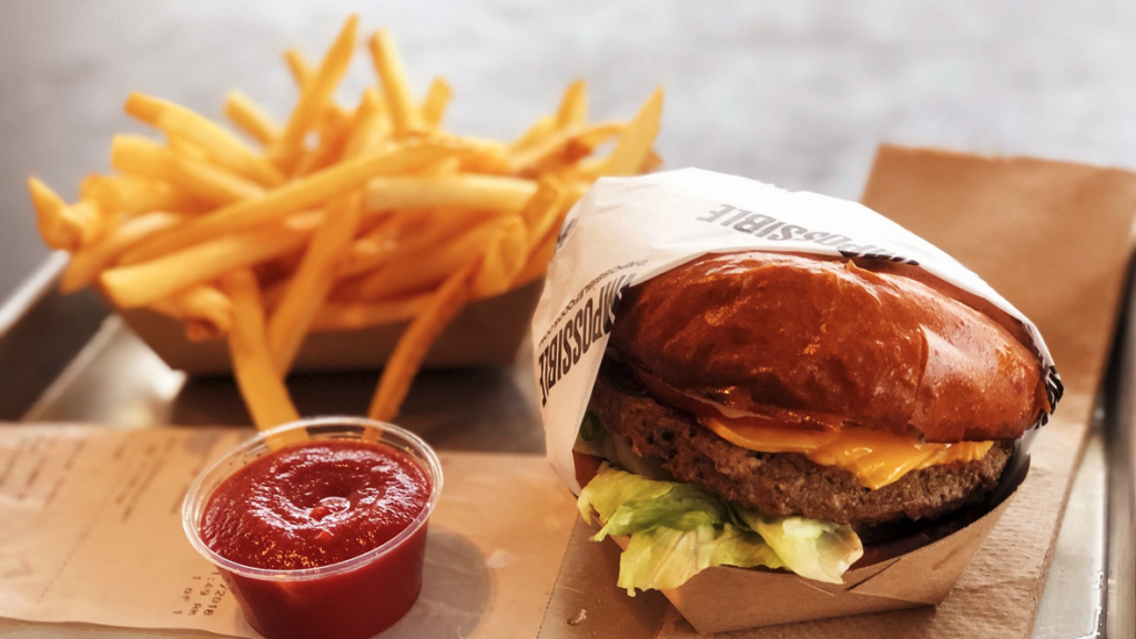 a burger and fries on a table