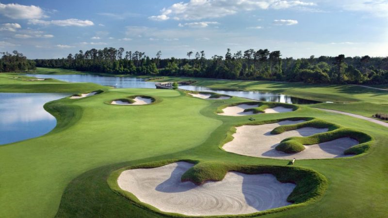 a golf course with sand bunkers