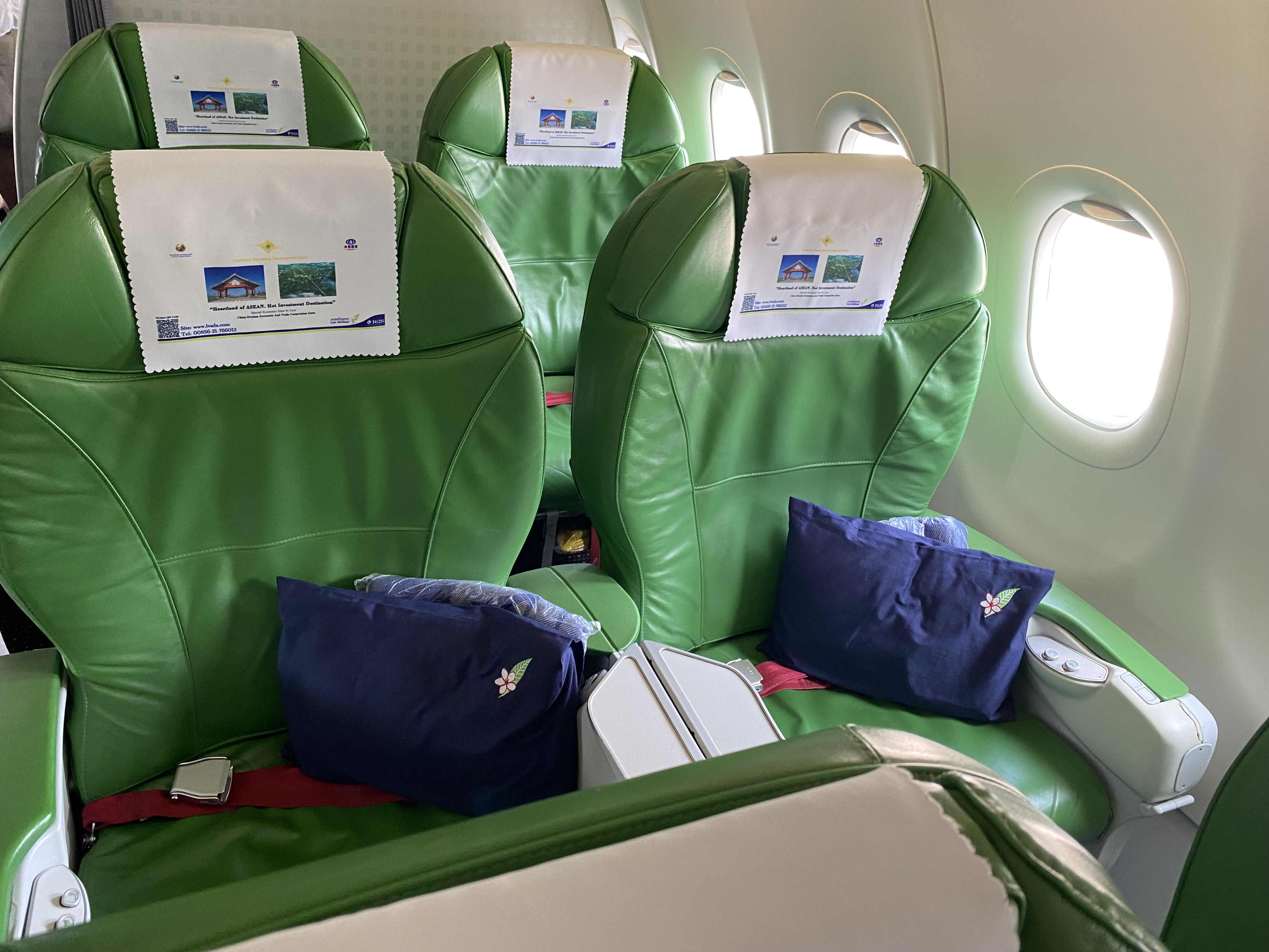 a green seats with white labels on them