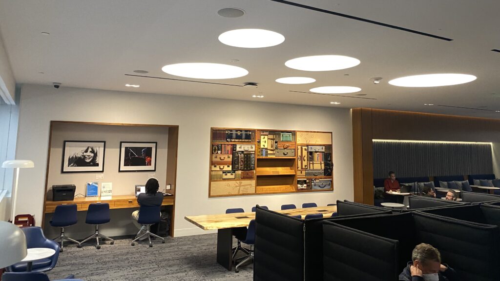 a room with a couple of people sitting at a desk