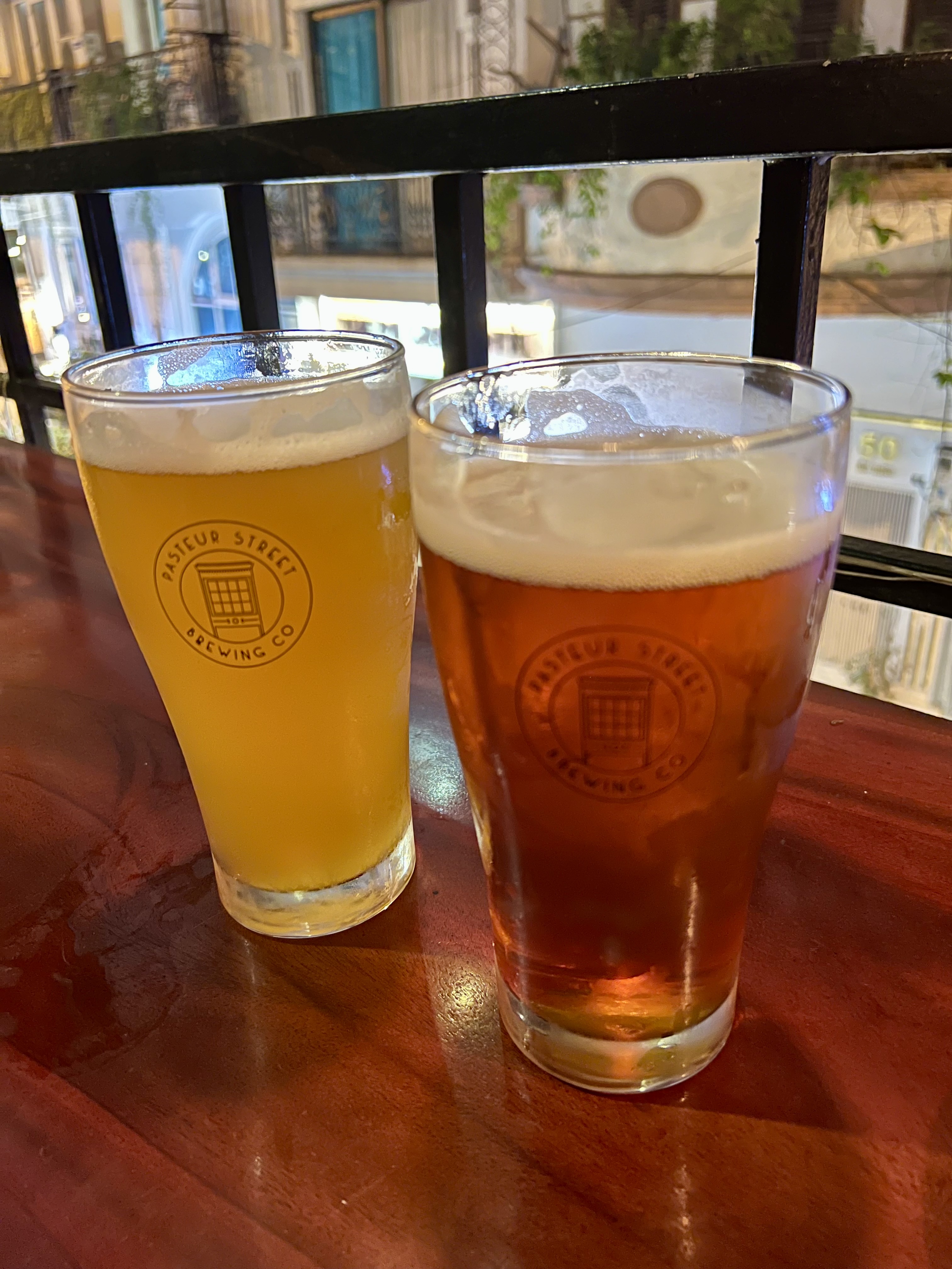 two glasses of beer on a table