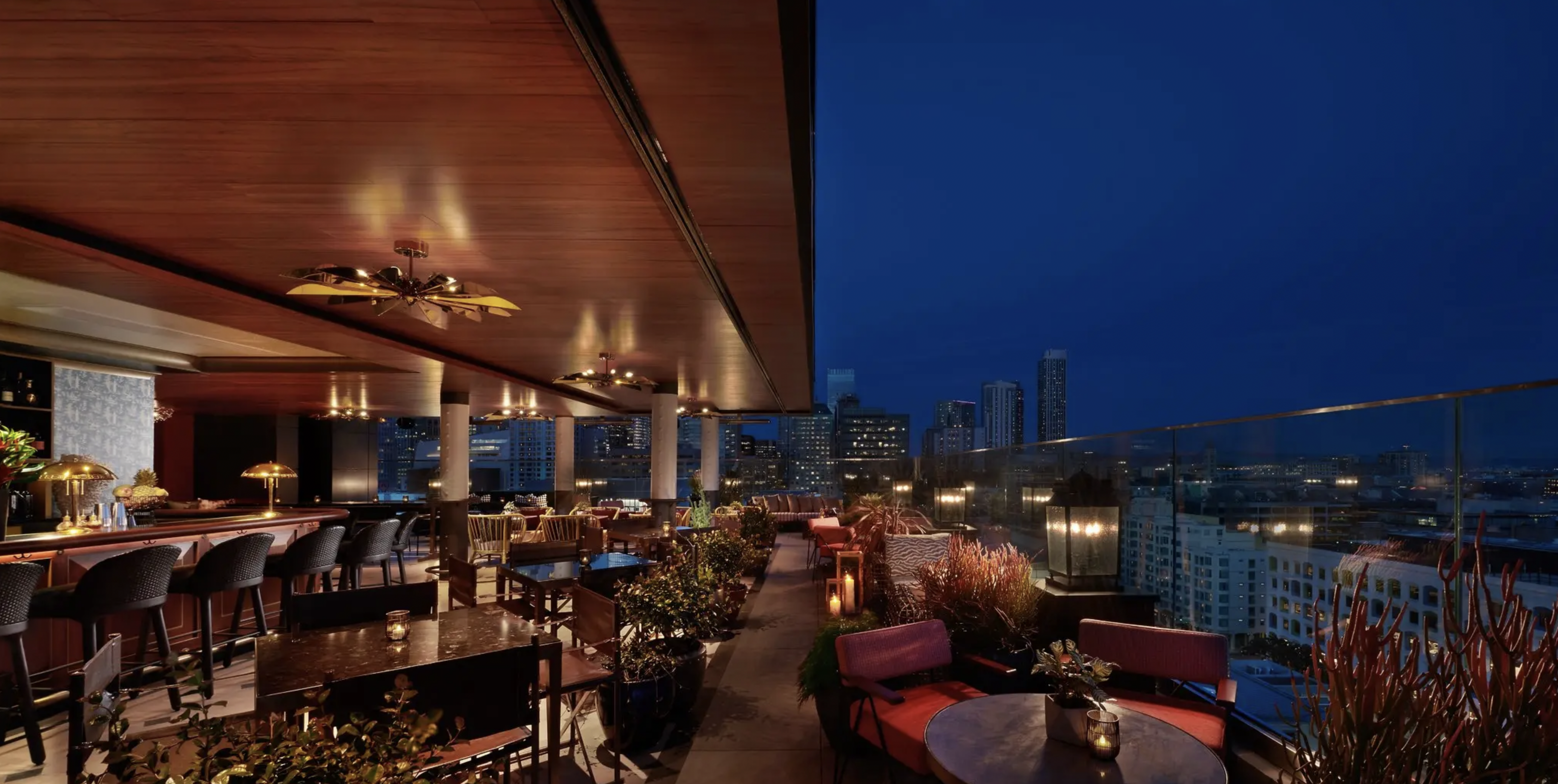 a rooftop restaurant with tables and chairs