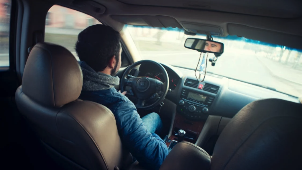 a man driving a car