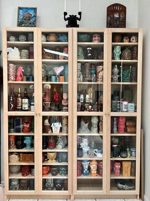 a group of glass shelves with various objects