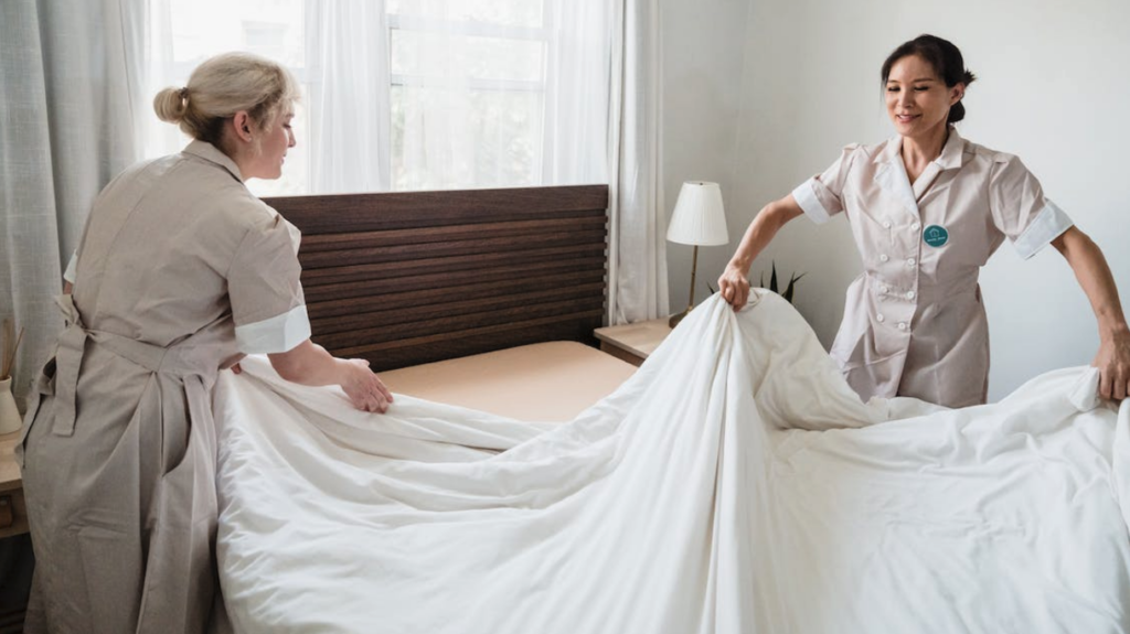 a woman making a bed