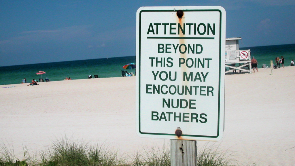 a sign on a beach