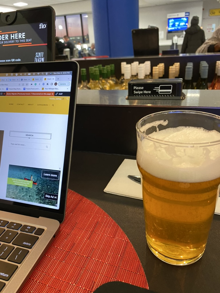 a laptop and a glass of beer
