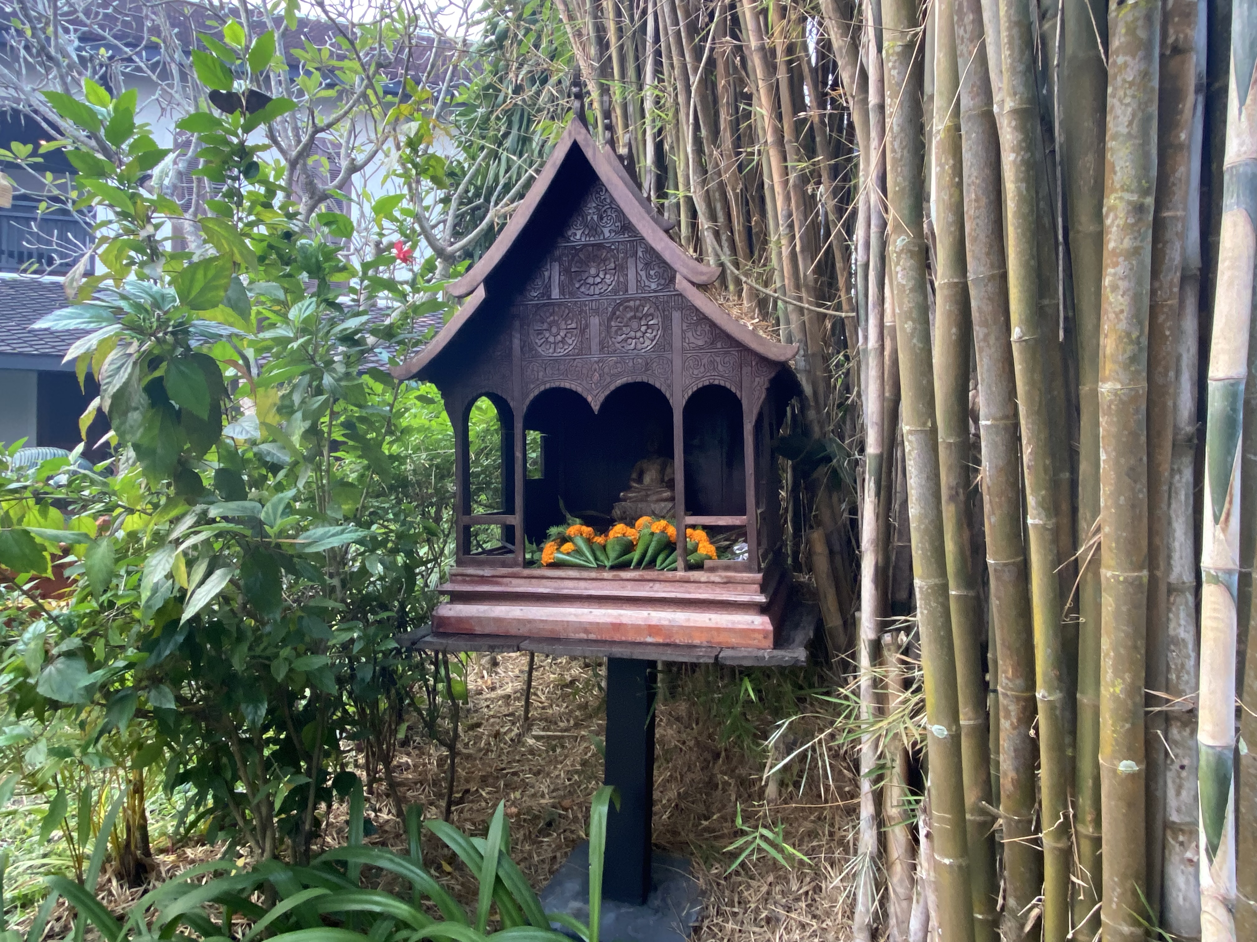 a small shrine in a garden