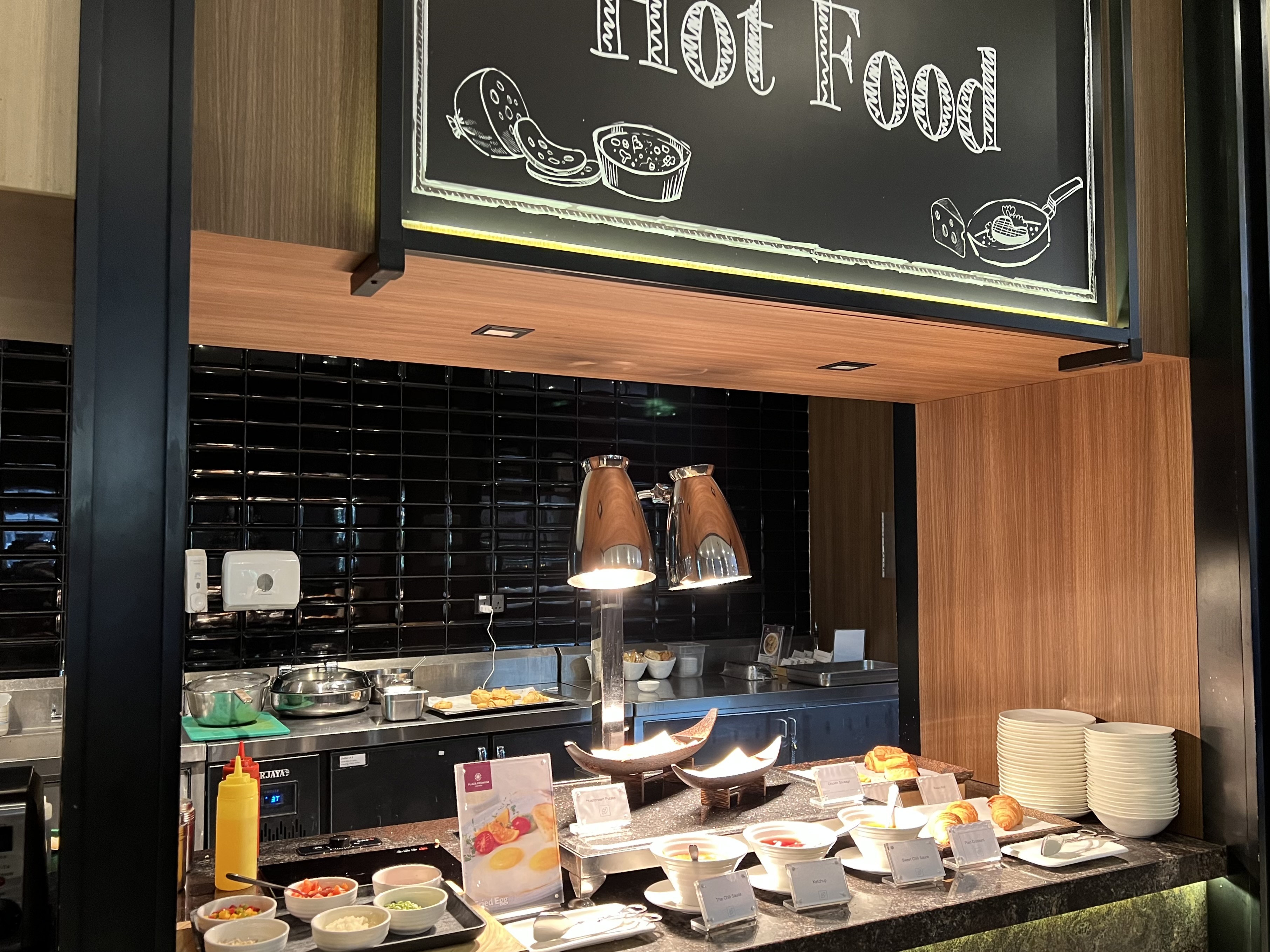 a food buffet with a sign above it