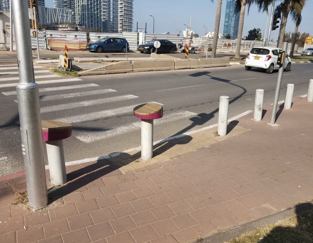 a street with cars and a crosswalk