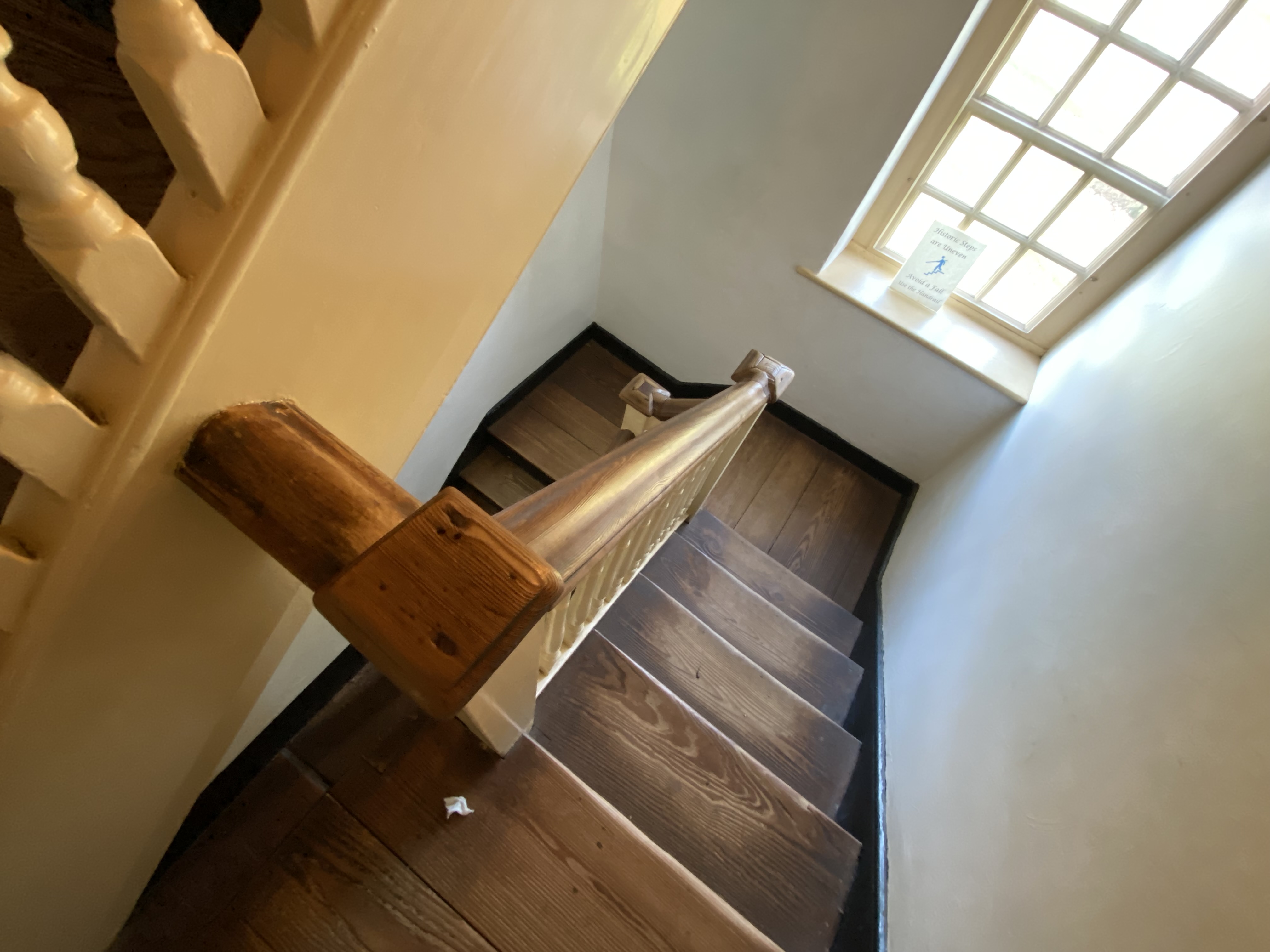 a wooden staircase with a window