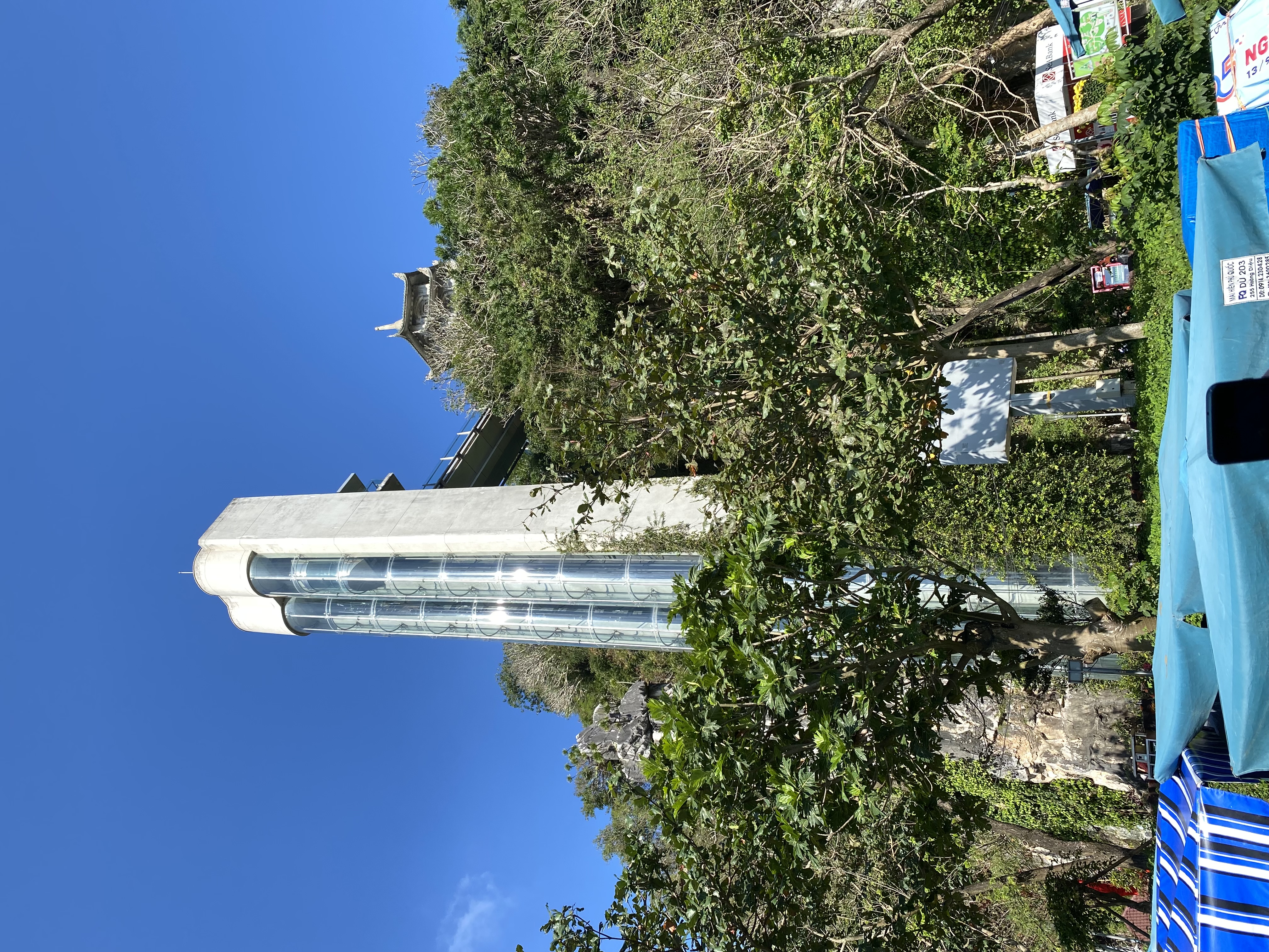 a tall building with trees around it