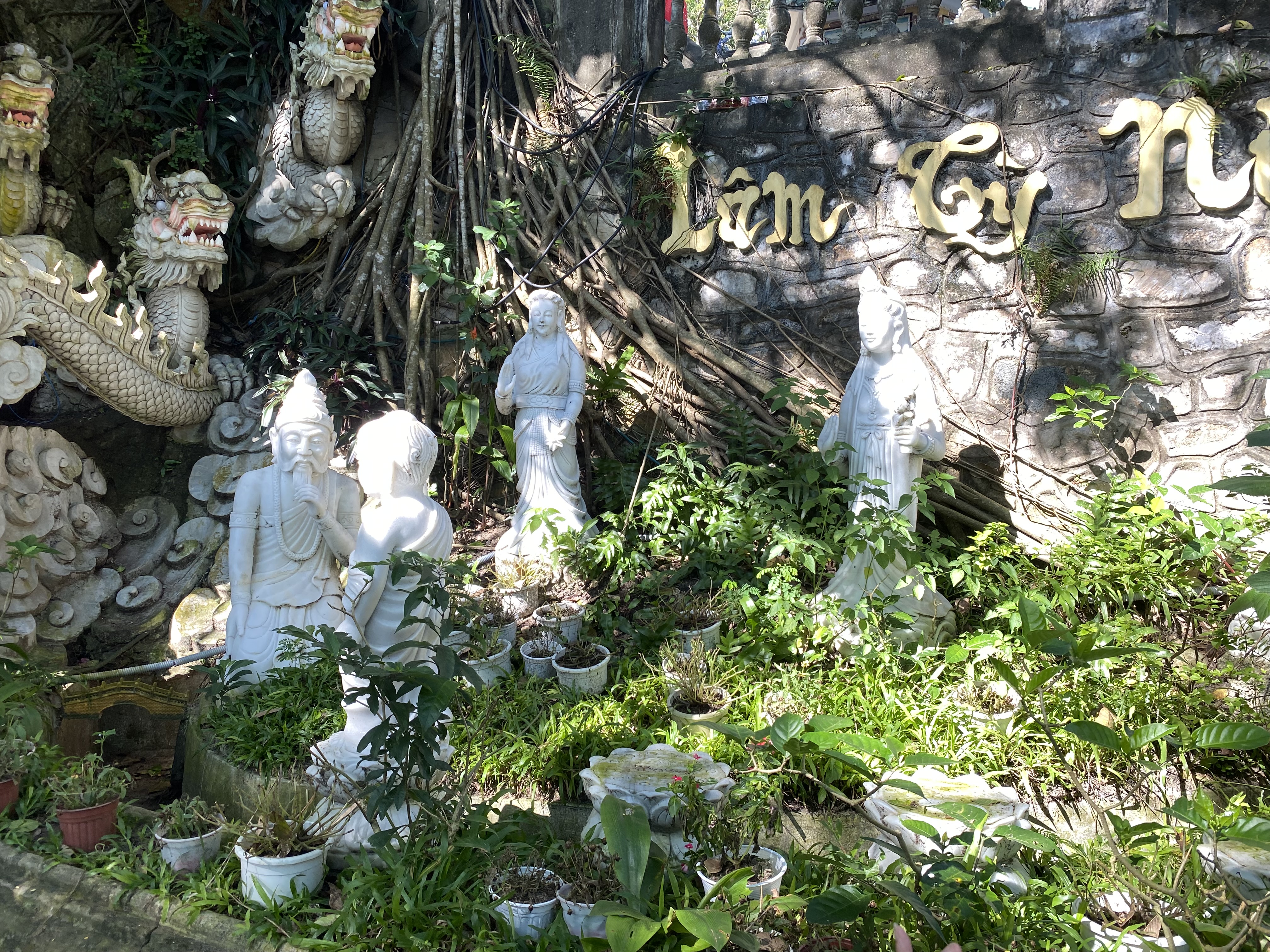 a group of statues in a garden