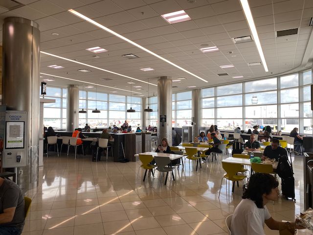 a large room with many tables and chairs