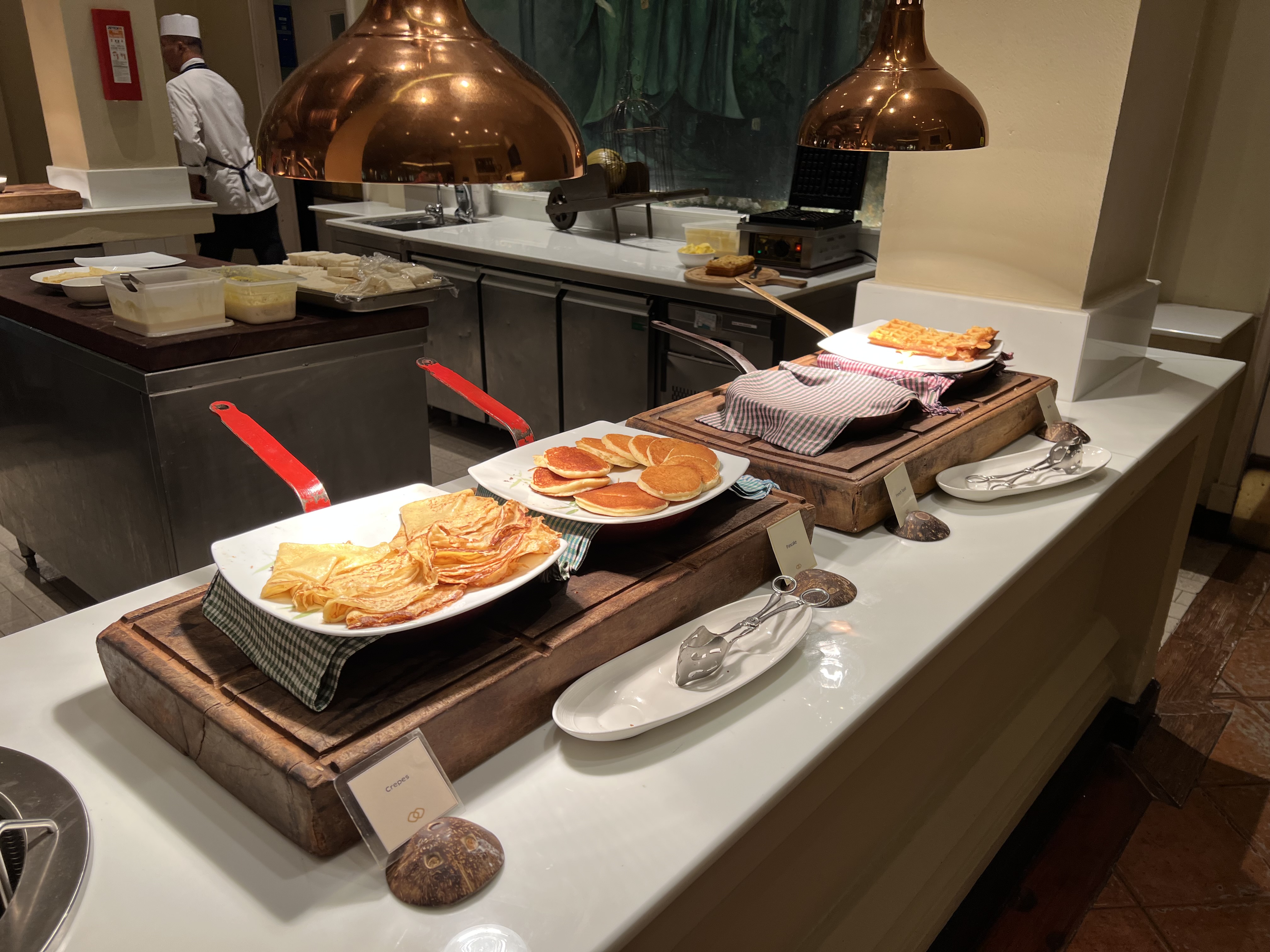 a group of plates of food on a counter