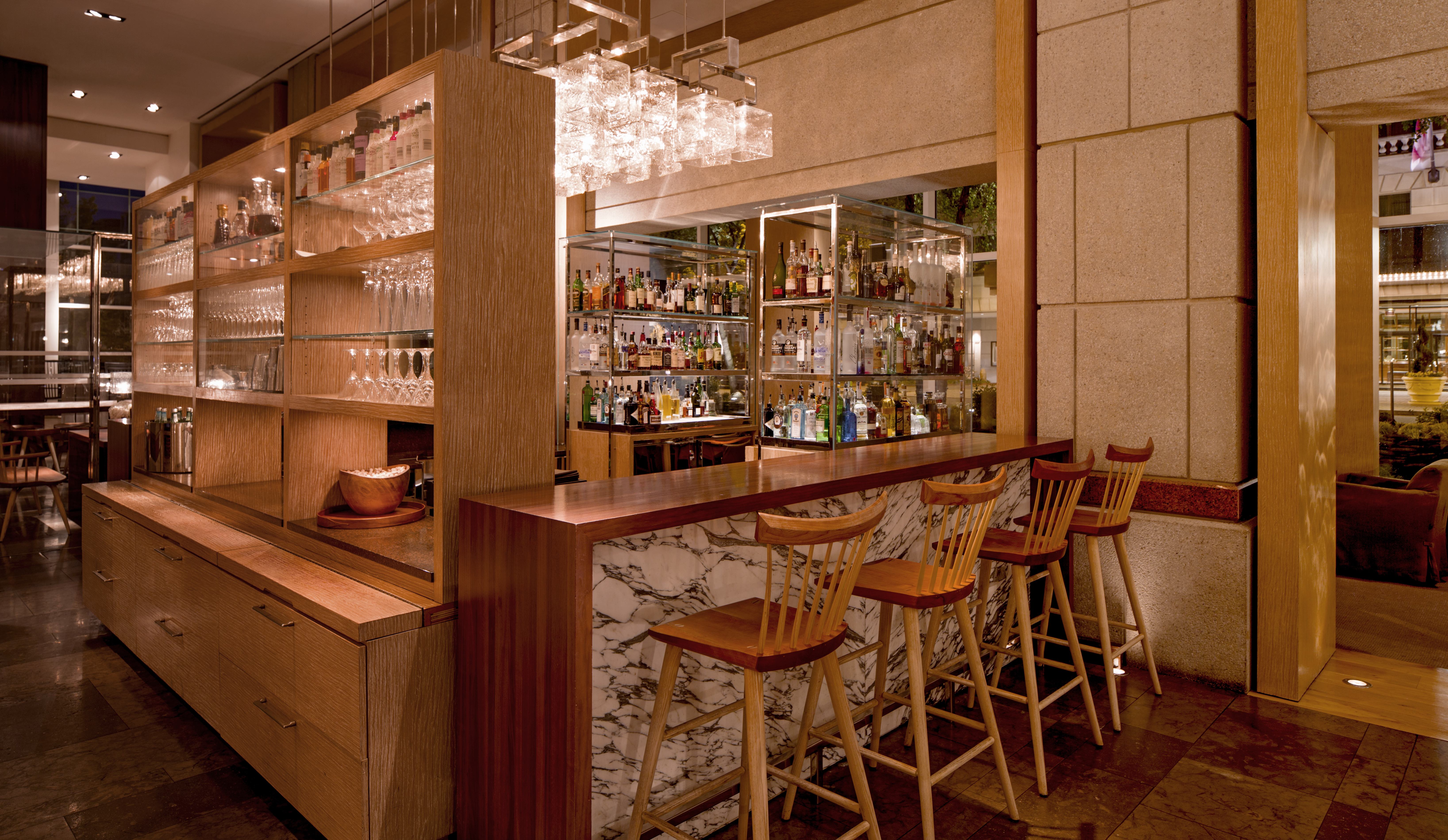 a bar with a counter and chairs