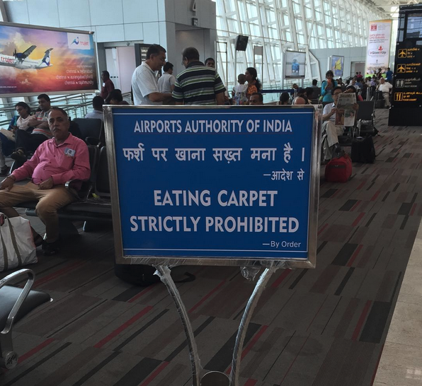 a blue sign in an airport