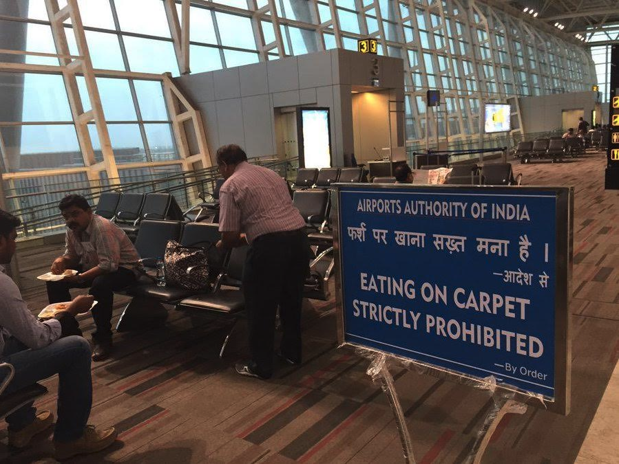 people sitting in an airport terminal