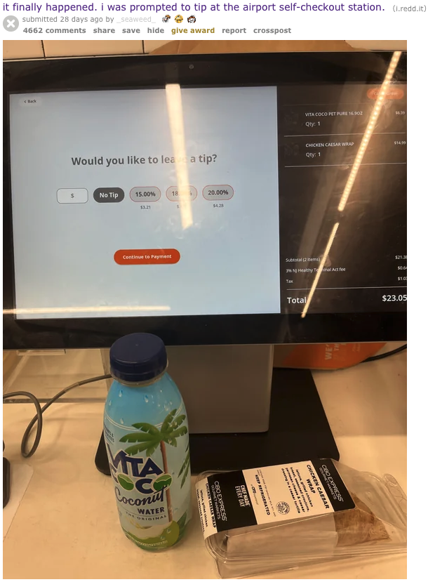 a computer screen with a screen and a bottle of juice