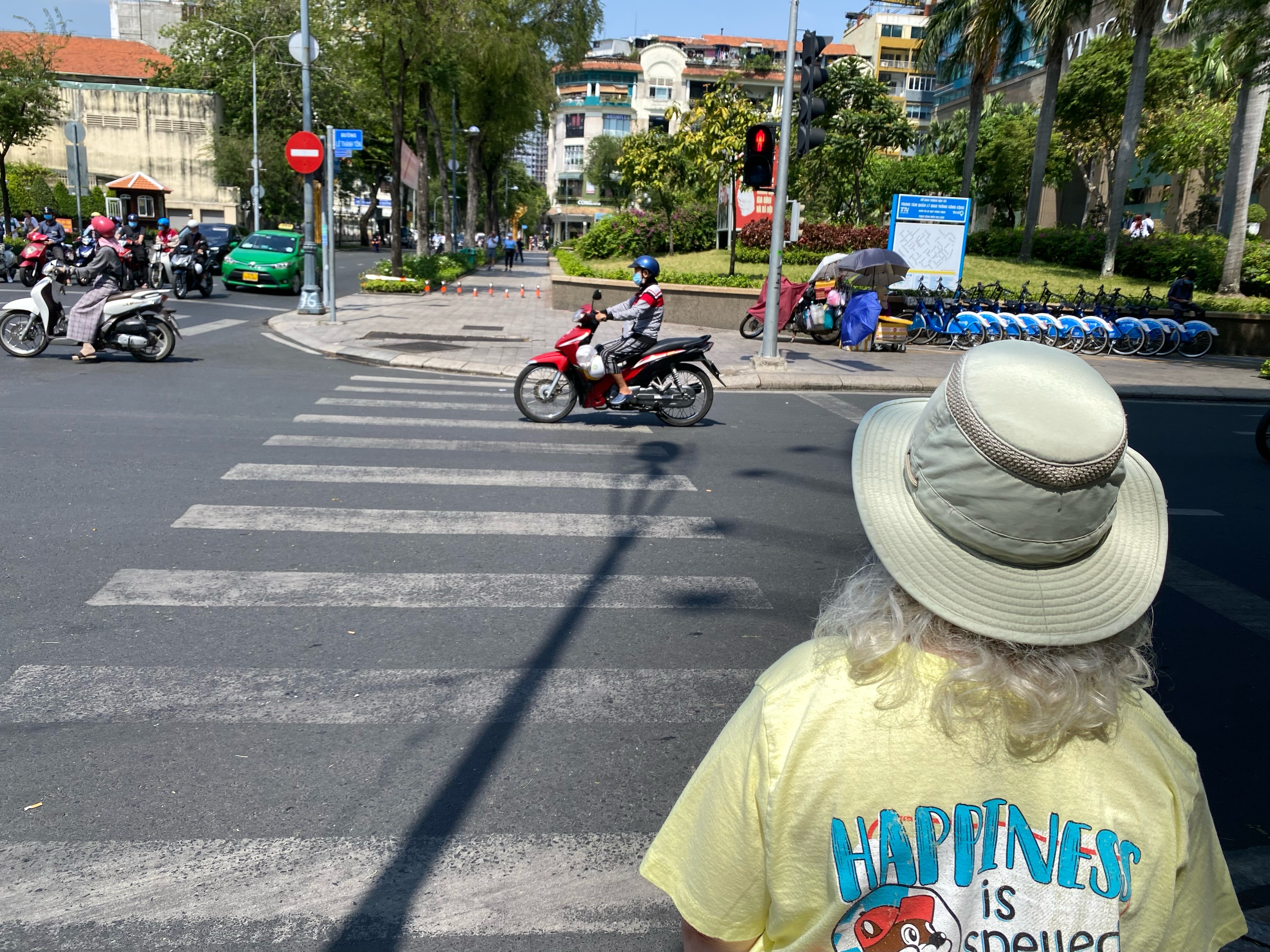 a person looking at a motorcycle on a street