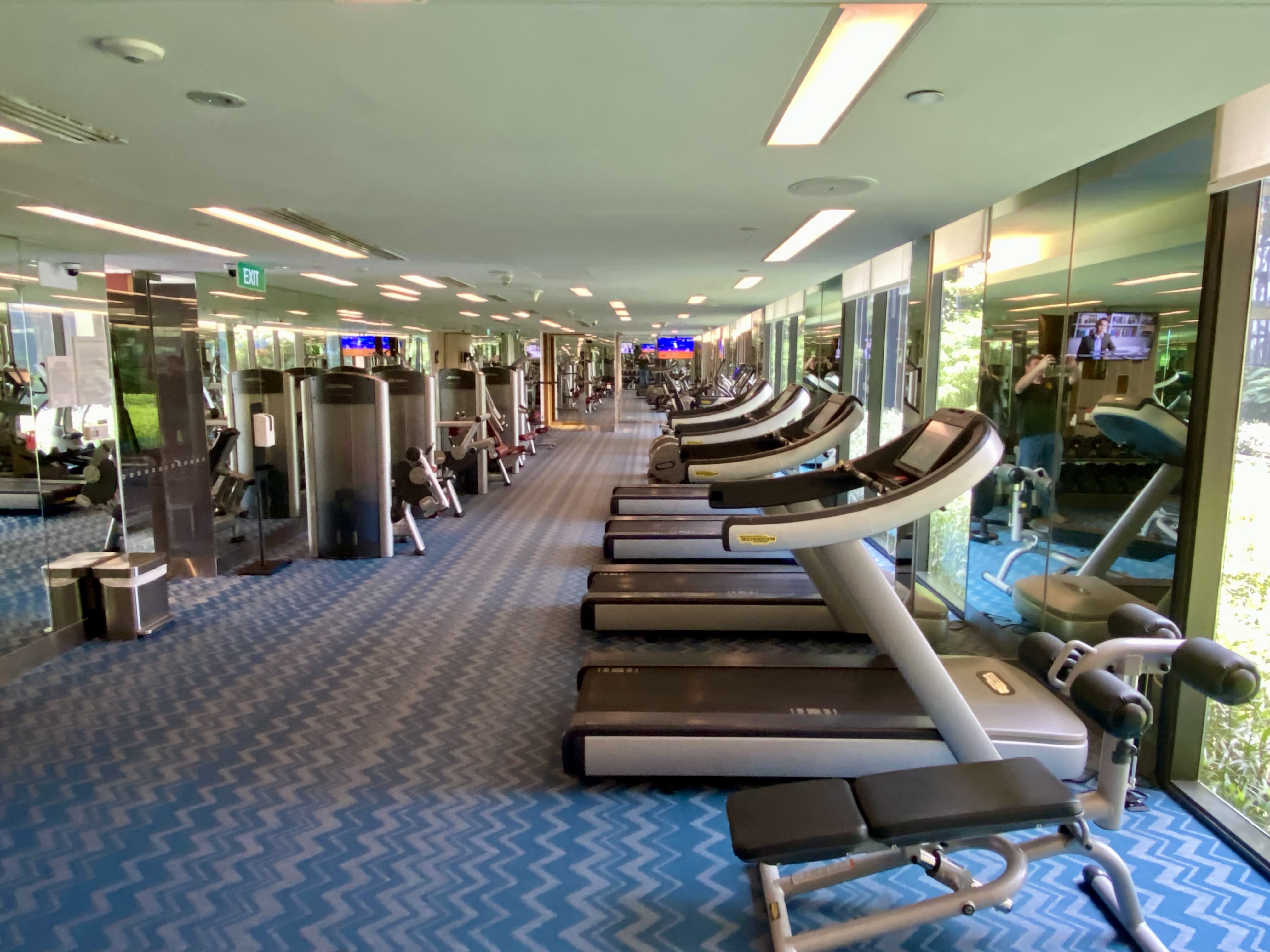 a room with treadmills and exercise equipment