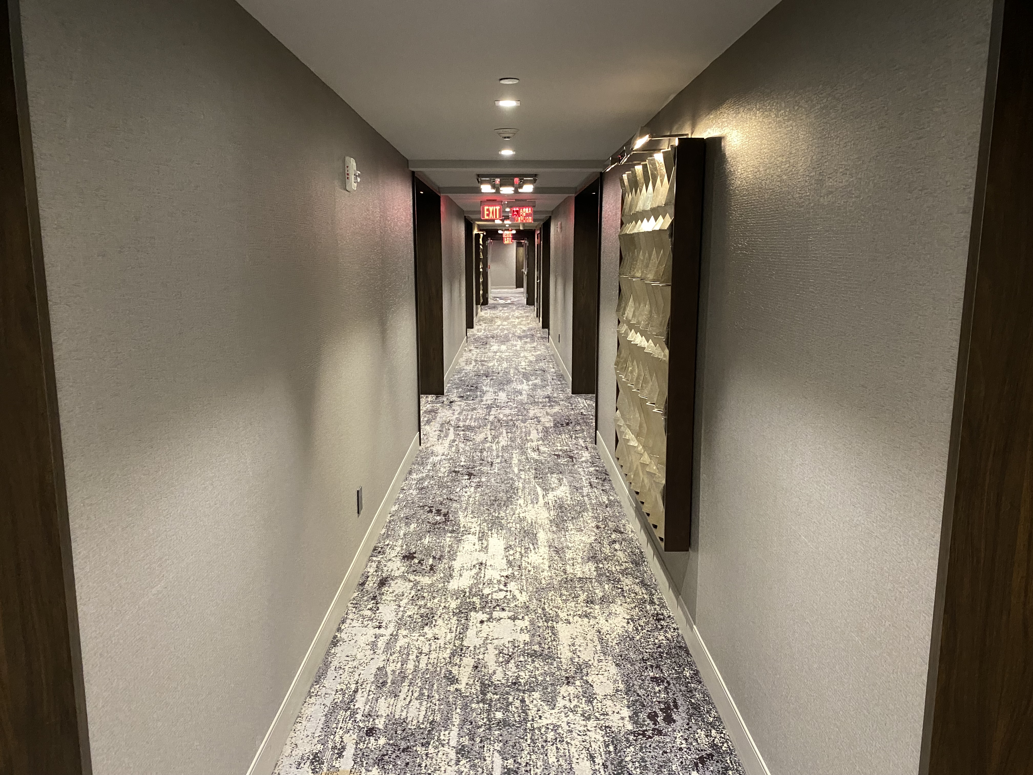 a hallway with a carpeted floor