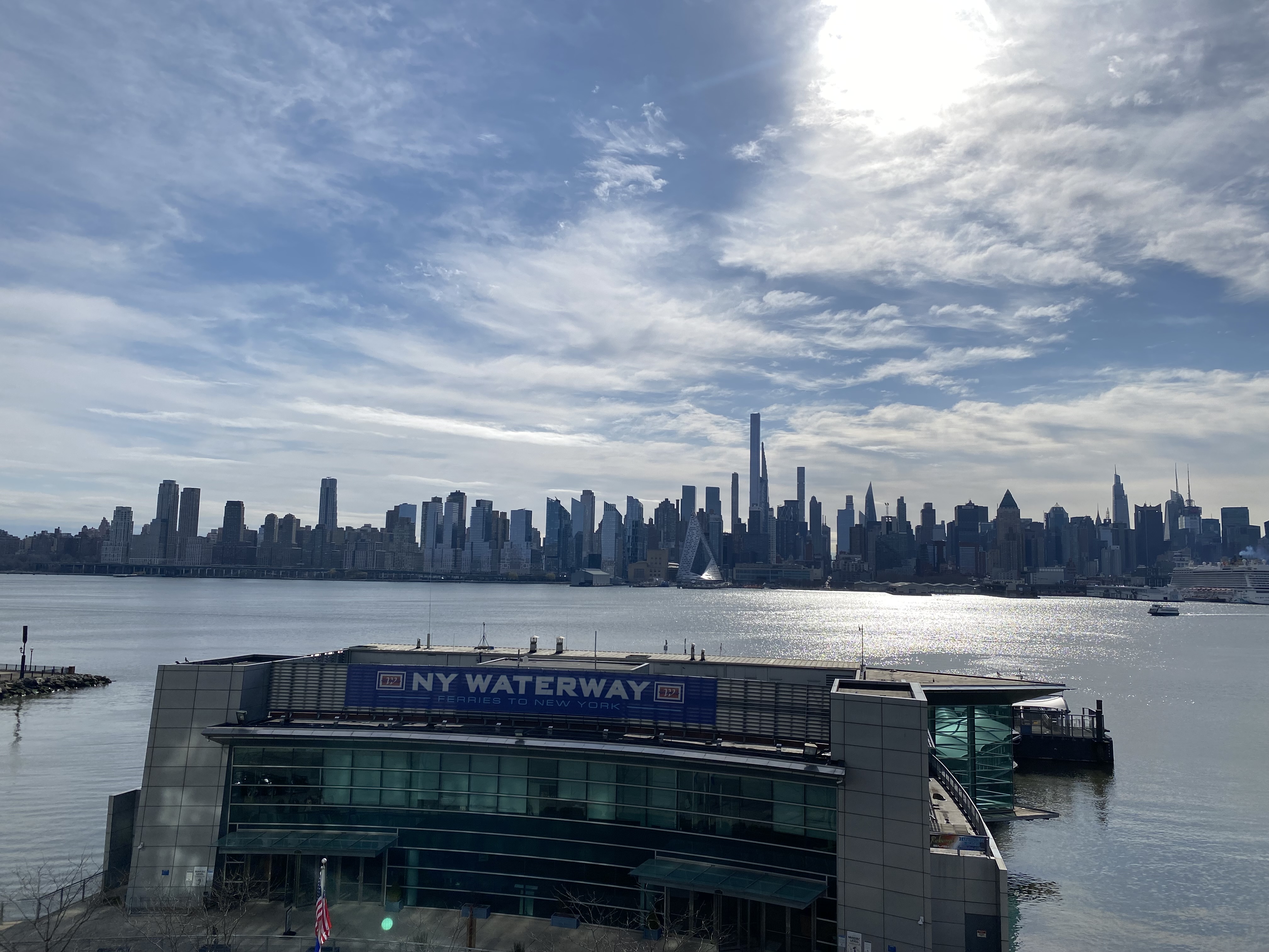 a city skyline with a body of water