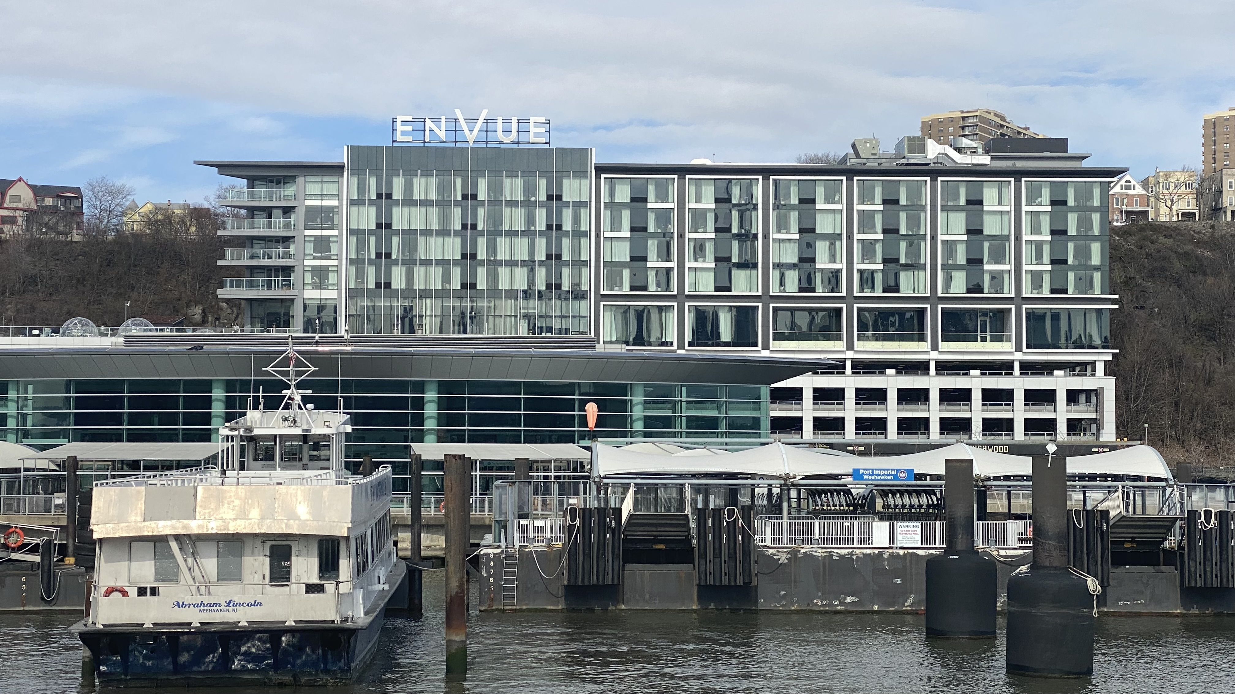 a building with a dock and boats in the water