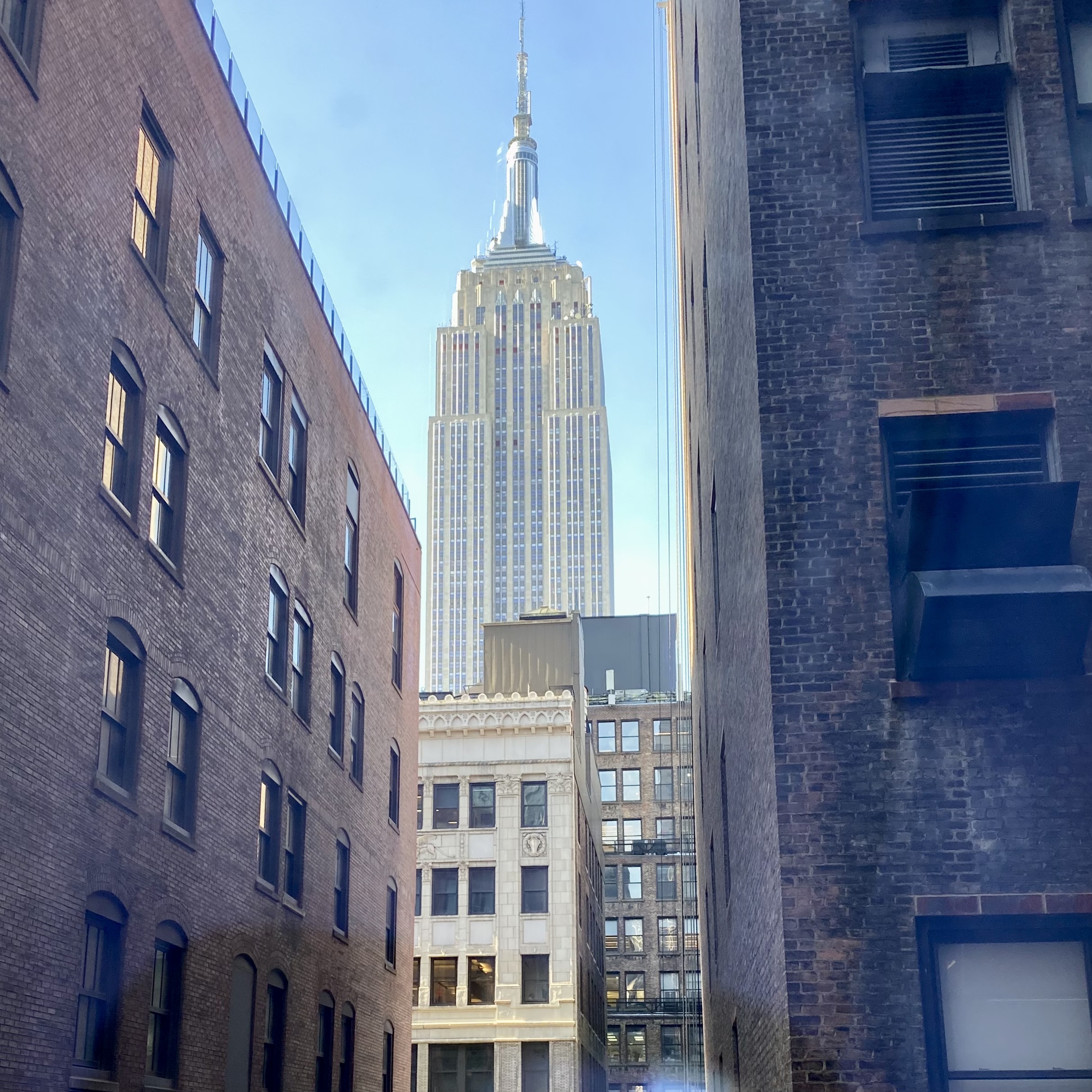 a tall building seen through a window