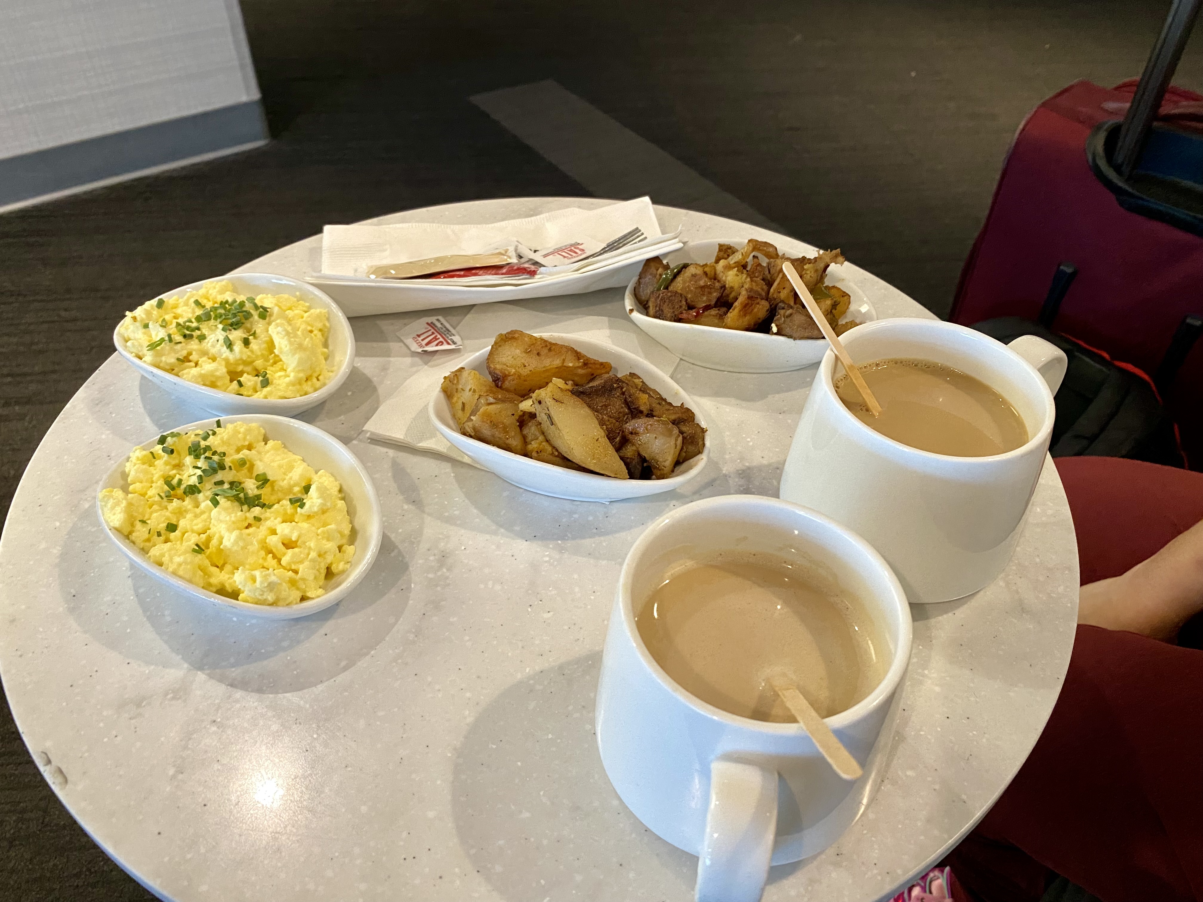 a table with cups of coffee and food on it