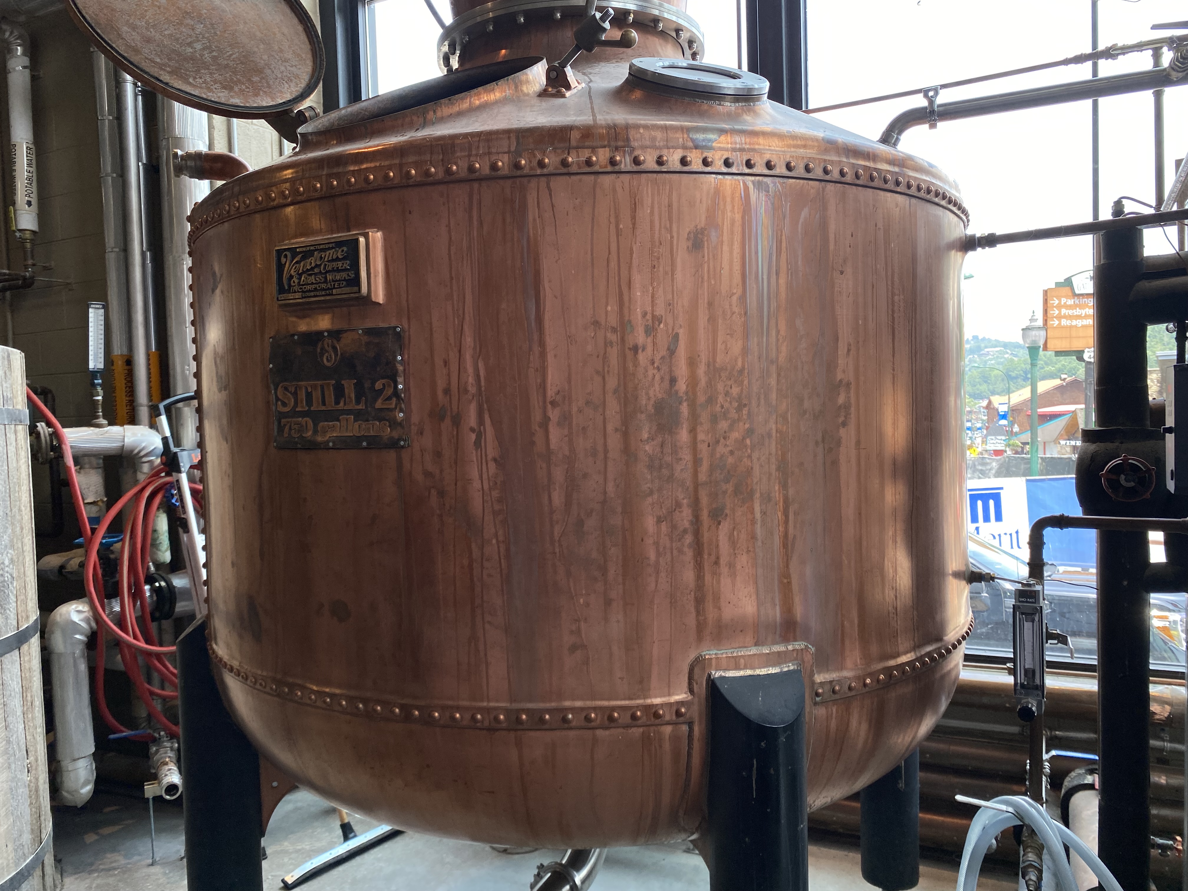 a large copper tank with a lid