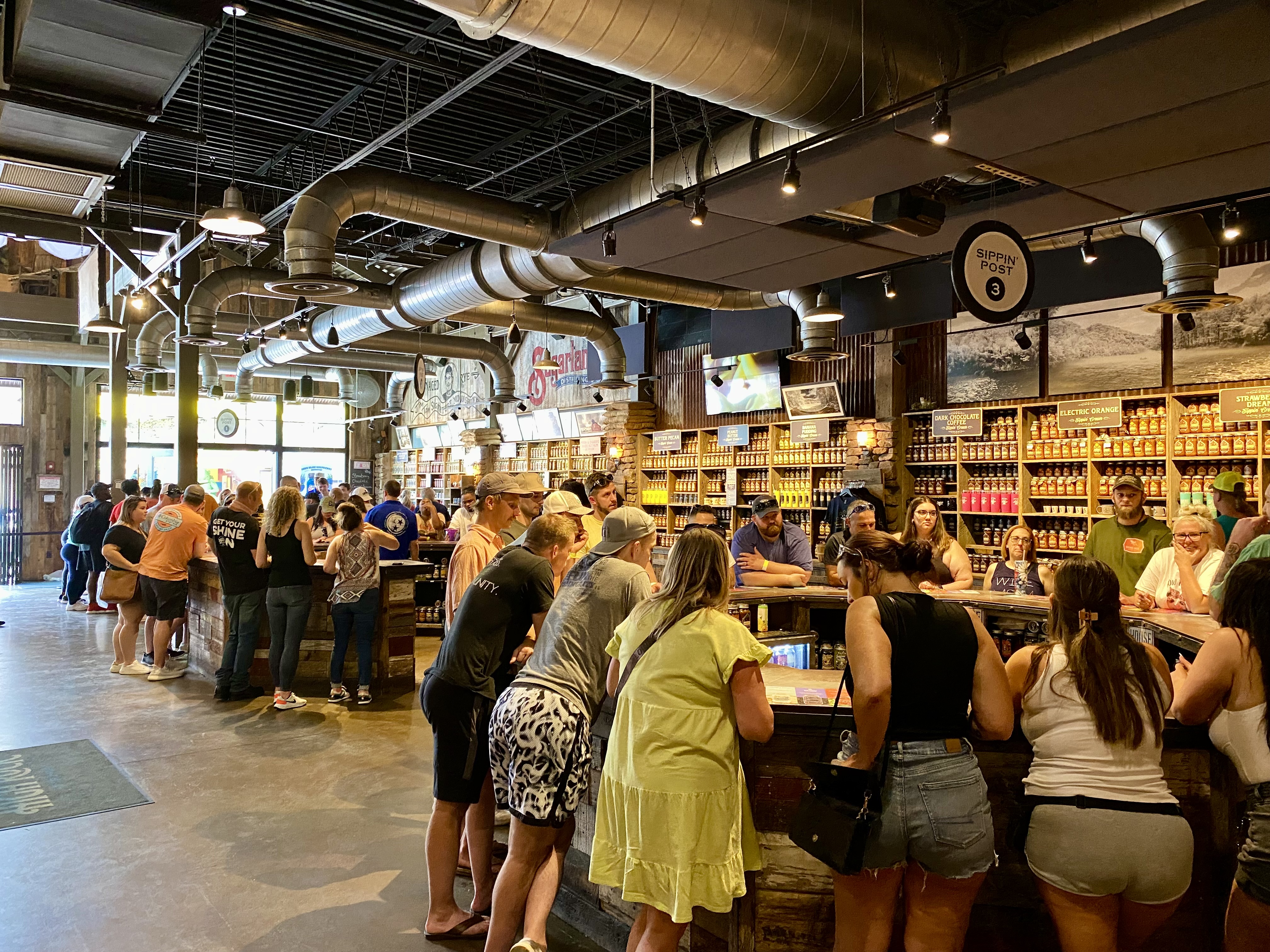 a group of people standing in a line at a counter