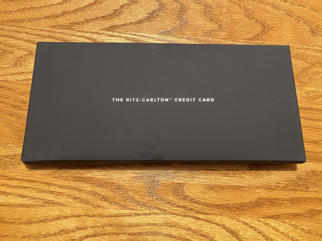 a black rectangular box on a wood surface