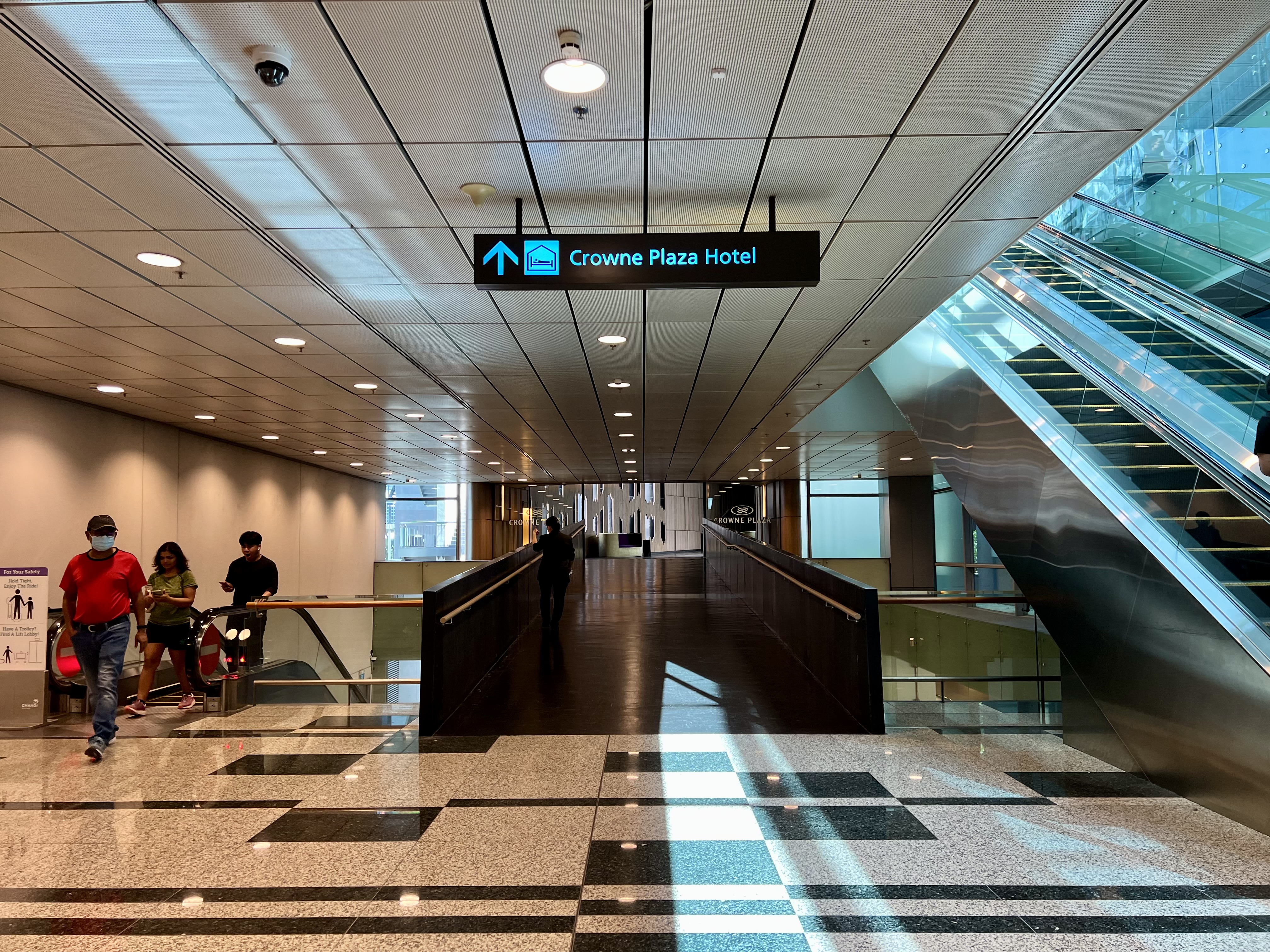 a building with escalators and a sign