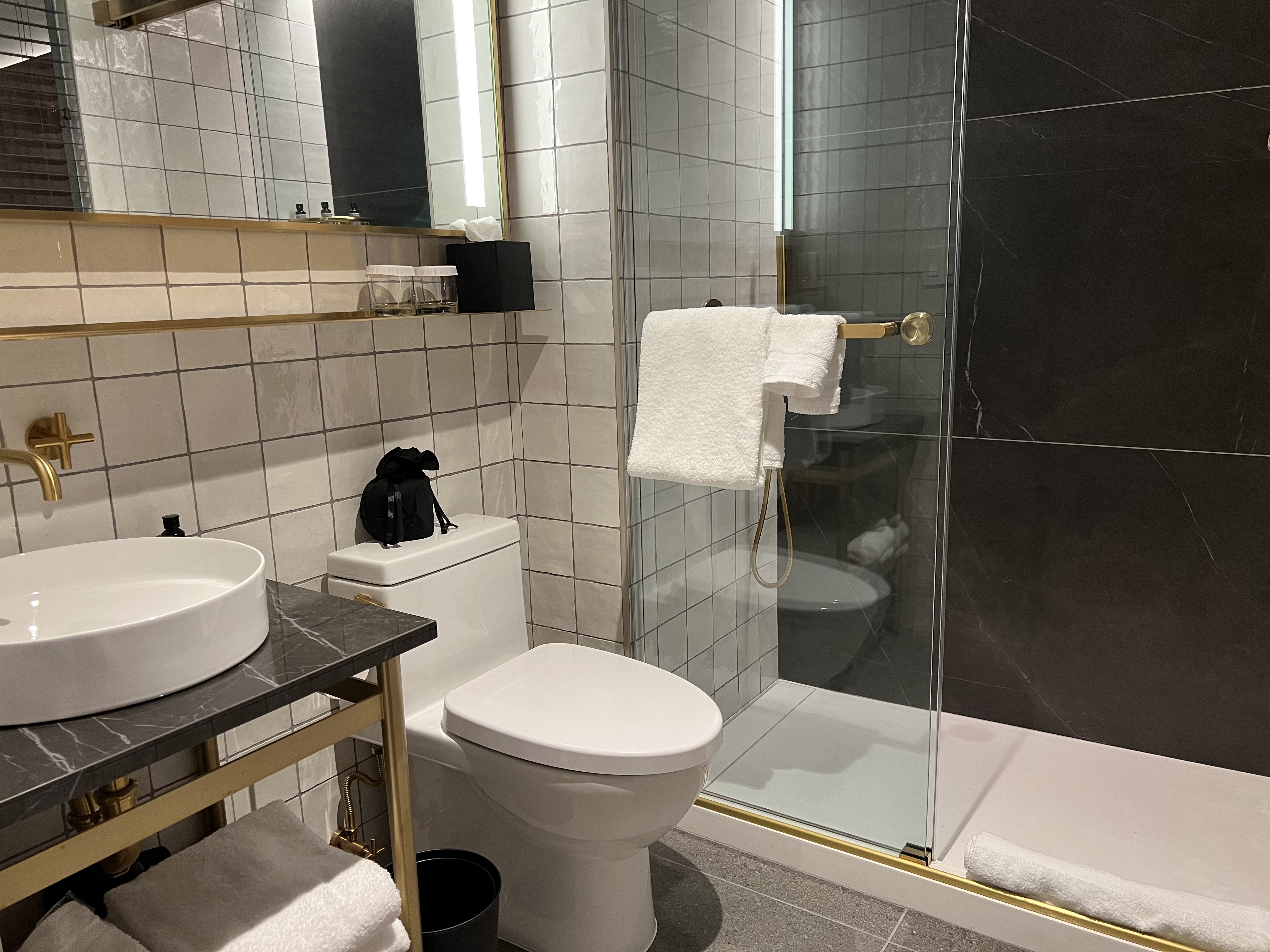 a bathroom with a glass shower door