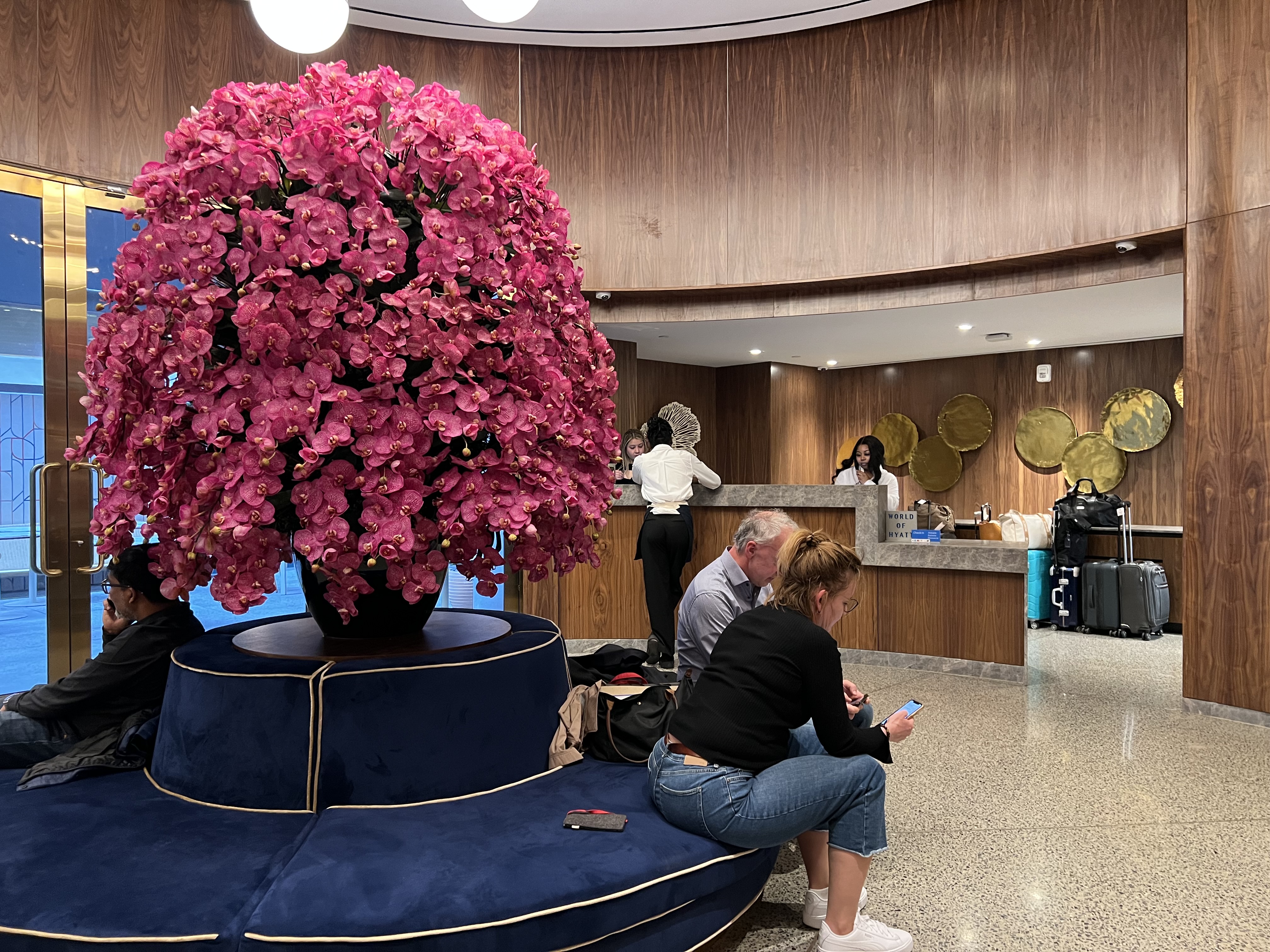 a group of people sitting in a lobby