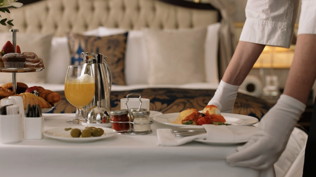 a person serving food on a table