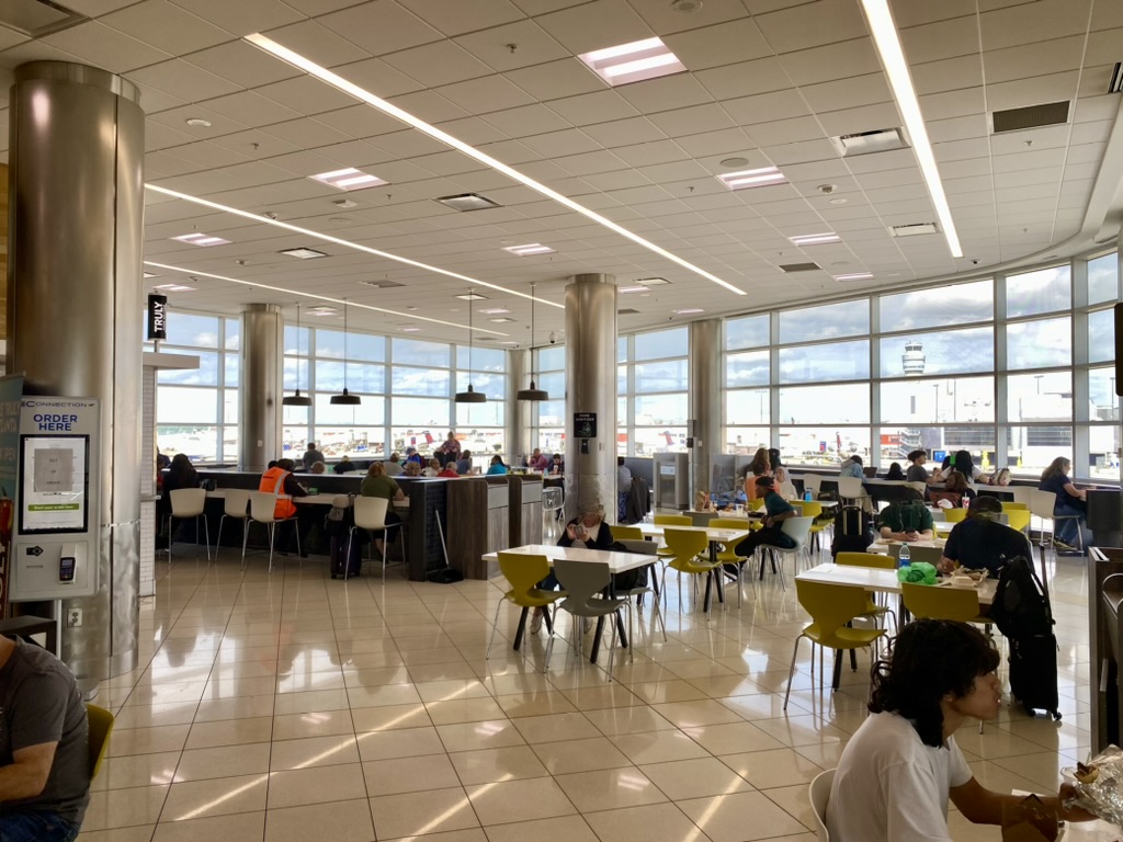 a large room with many tables and chairs