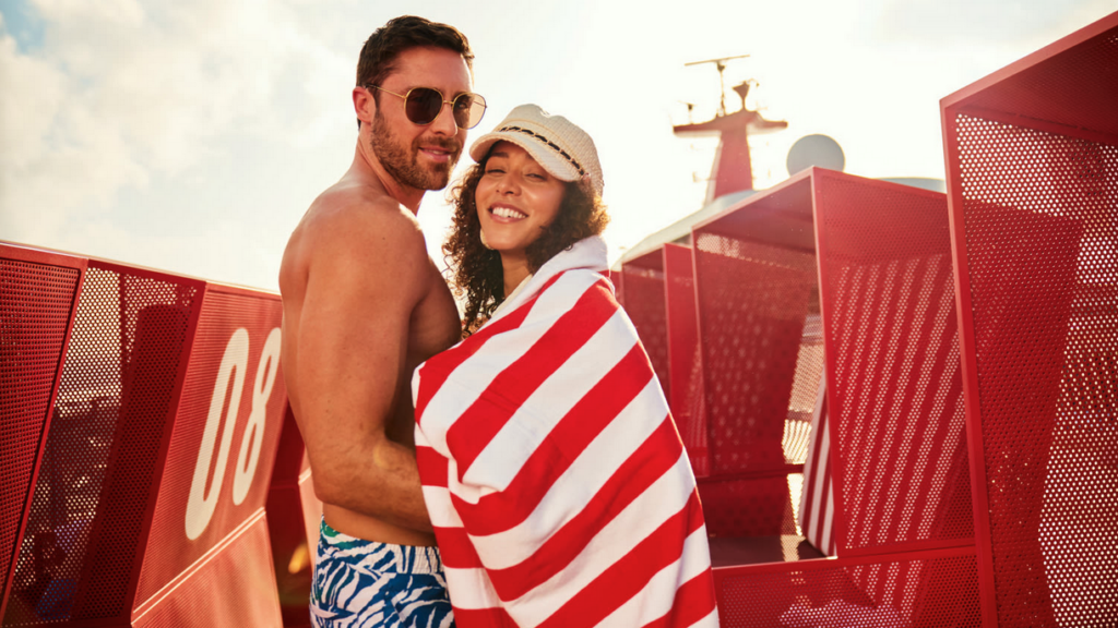 a man and woman wrapped in a towel