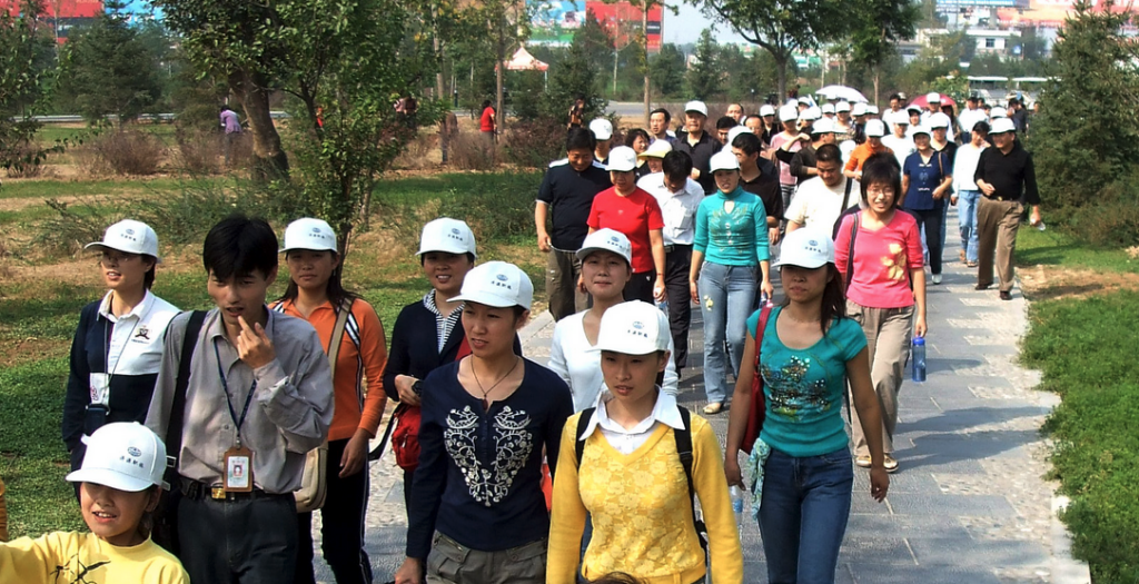 a group of people walking in a park