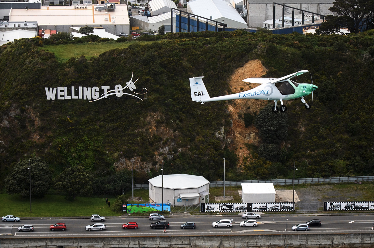 a plane flying over a road